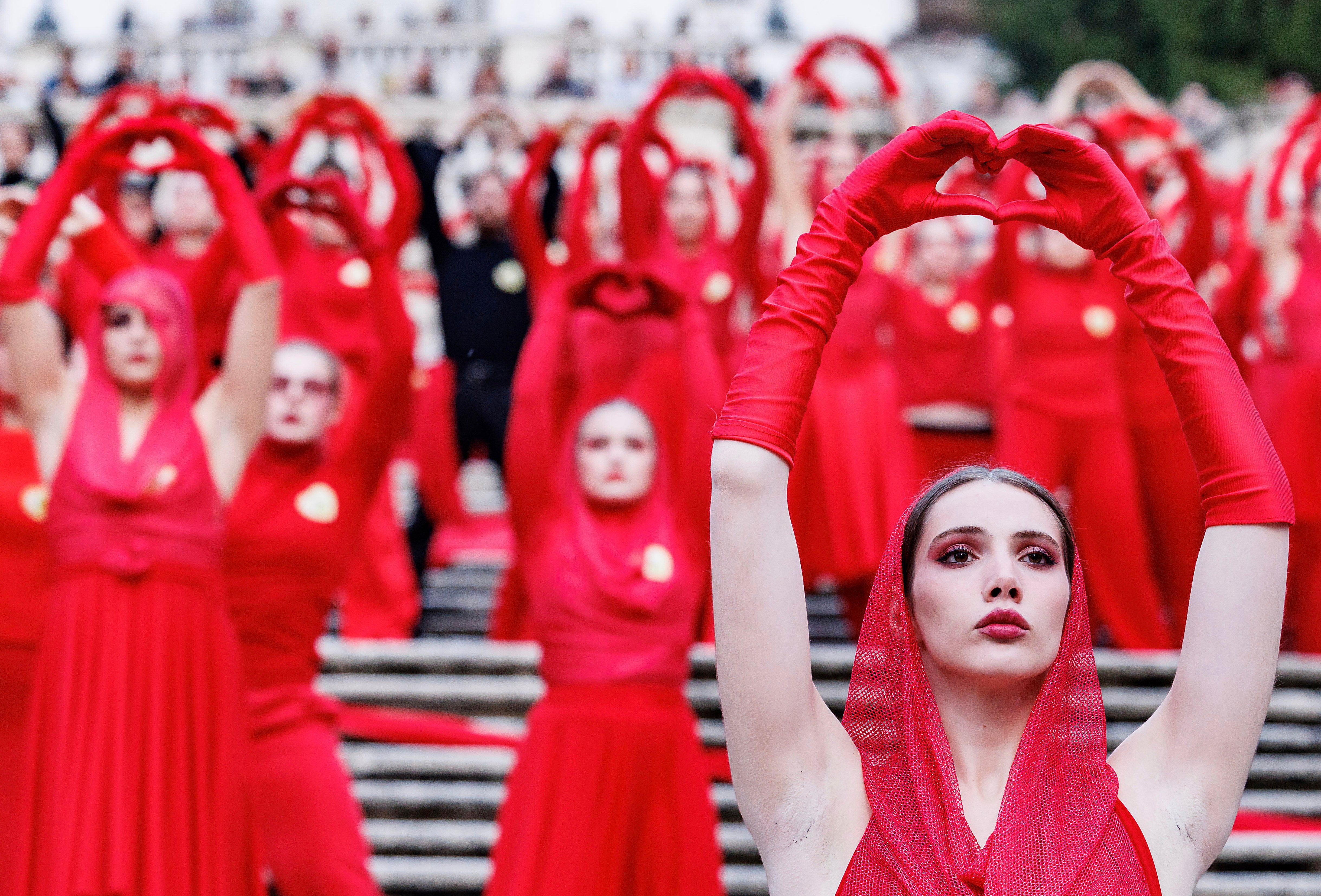 Activists perform on the occasion of the International Day for the Elimination of Violence against Women, in Rome