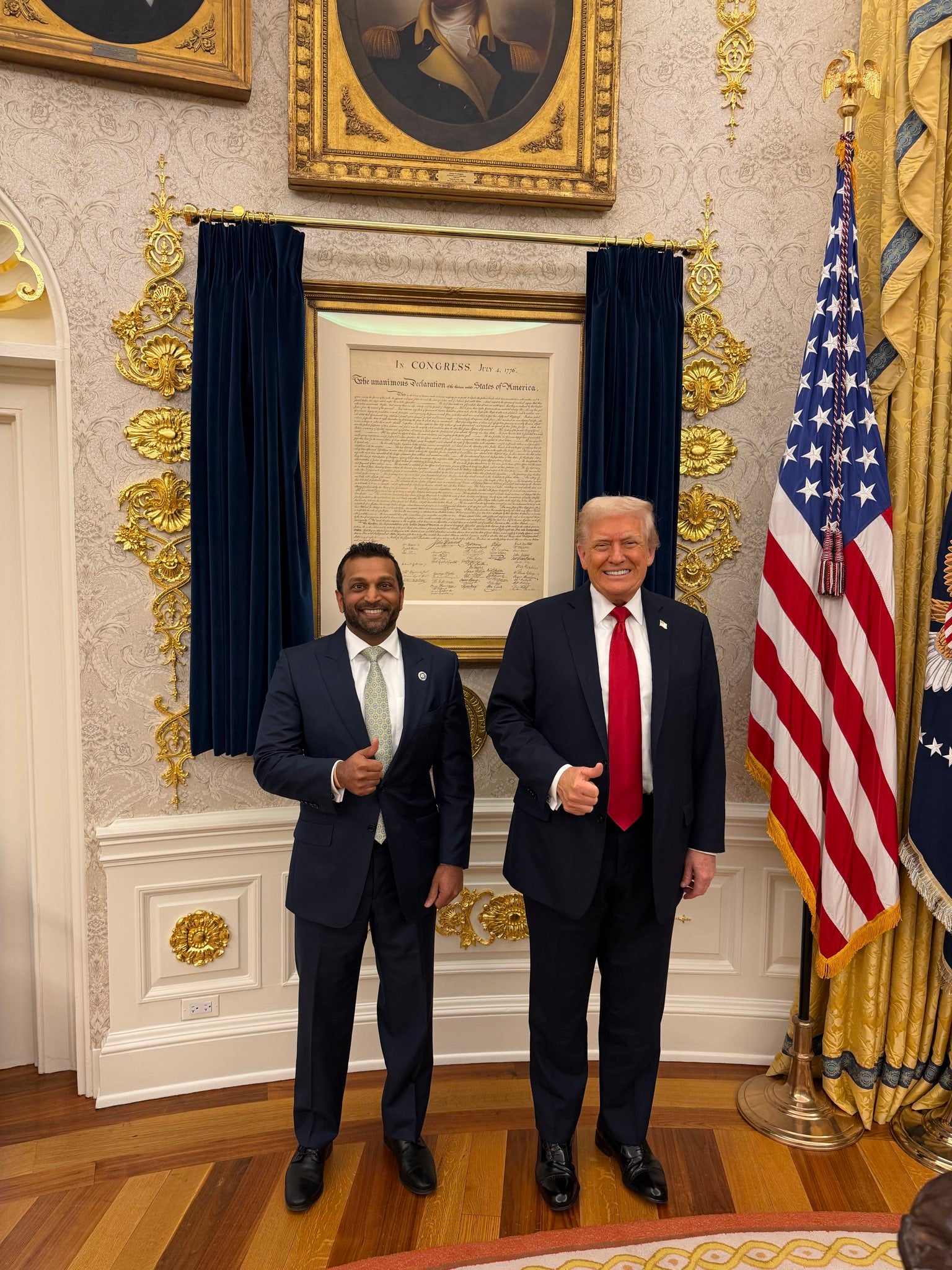 Trump and FBI Director Kash Patel posed for a photo in front of a framed copy of the Declaration of Independence hanging in the Oval Office following a report that claimed the president was on the verge of firing the FBI director.