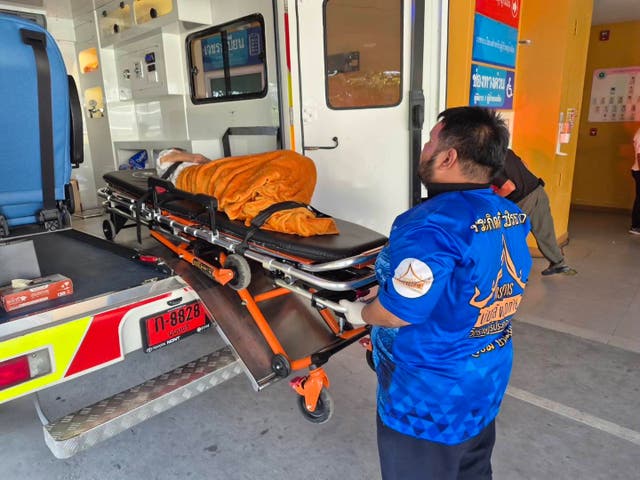 <p>An emergency response team transports Chonthirat Sakulkoo to hospital after she was found alive in her coffin in Nonthaburi, Thailand</p>