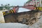 Flash floods and landslides on Indonesian island leave at least 10 dead and others missing
