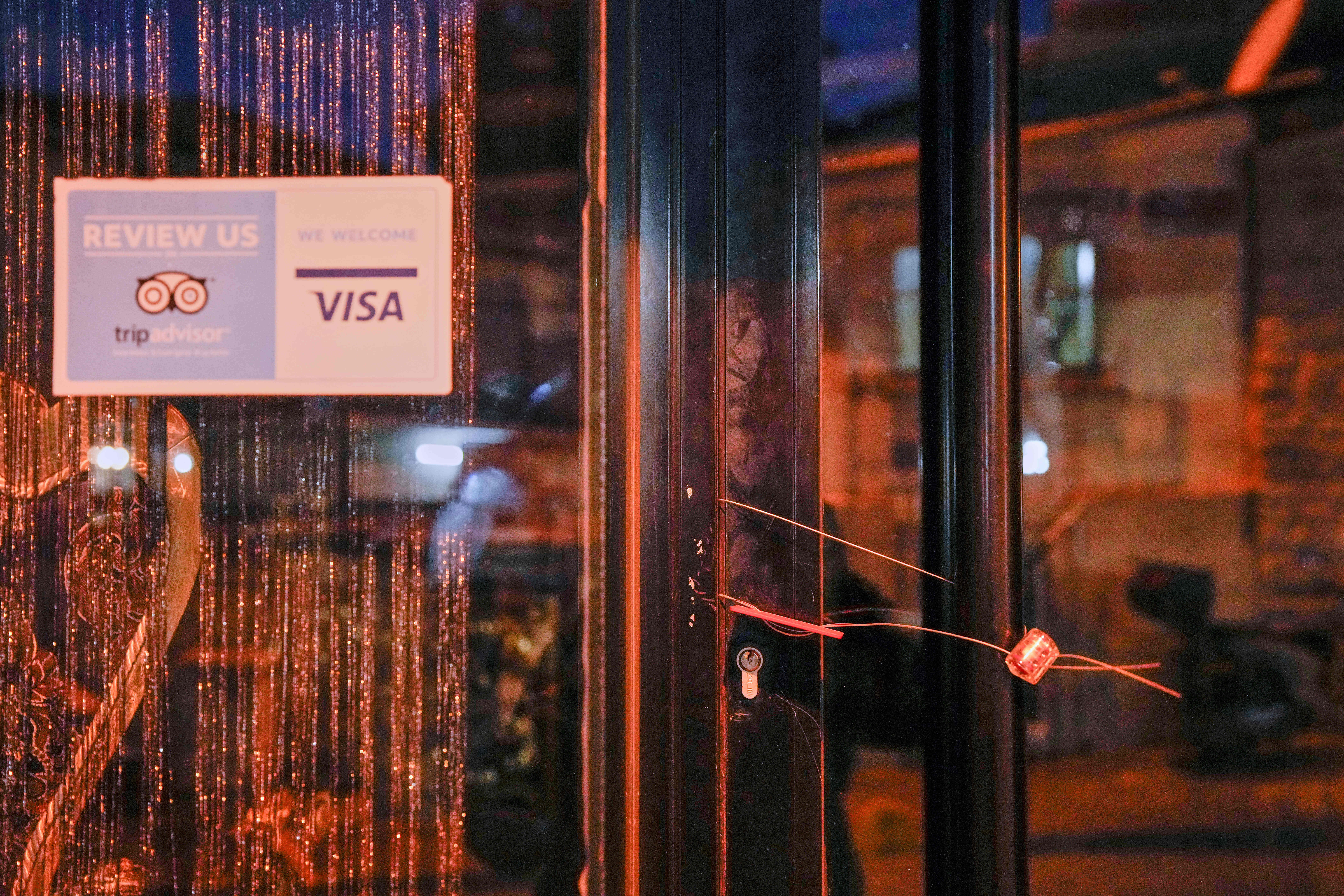 The main entrance door of the Harbour Suites Old City hotel is sealed, in Istanbul, Turkey, Monday, Nov. 24, 2025. (AP Photo/Emrah Gurel)