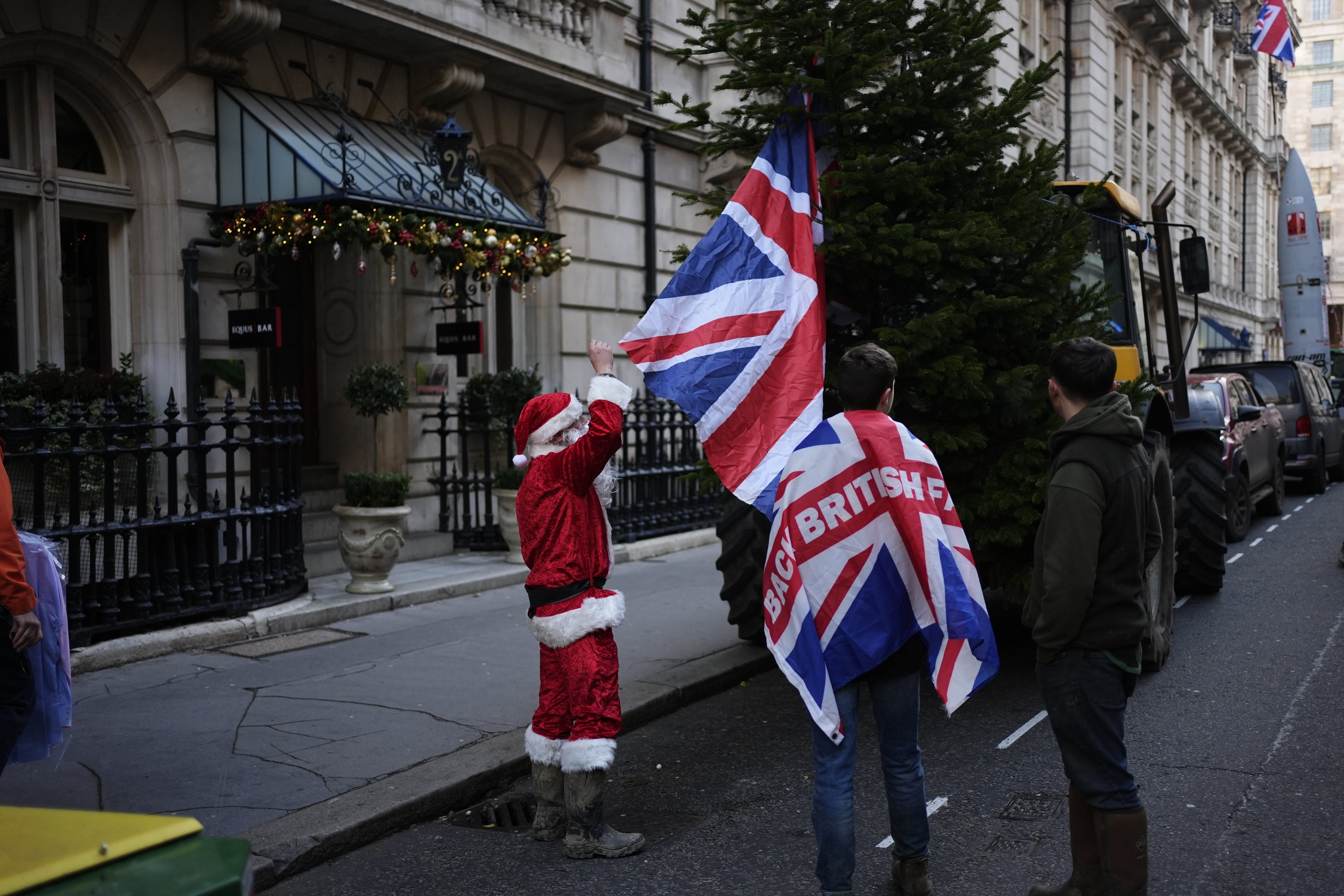 One protester dressed as Santa had a ‘naughty list’ of Government figures
