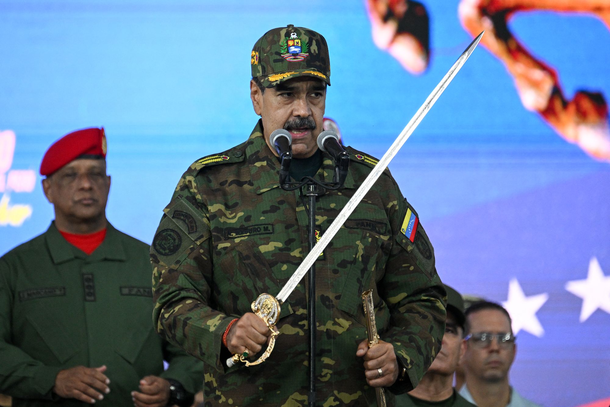 Venezuela's President Nicolas Maduro delivers a speech while holding the Venezuelan independence hero Simon Bolivar's Sword of Peru