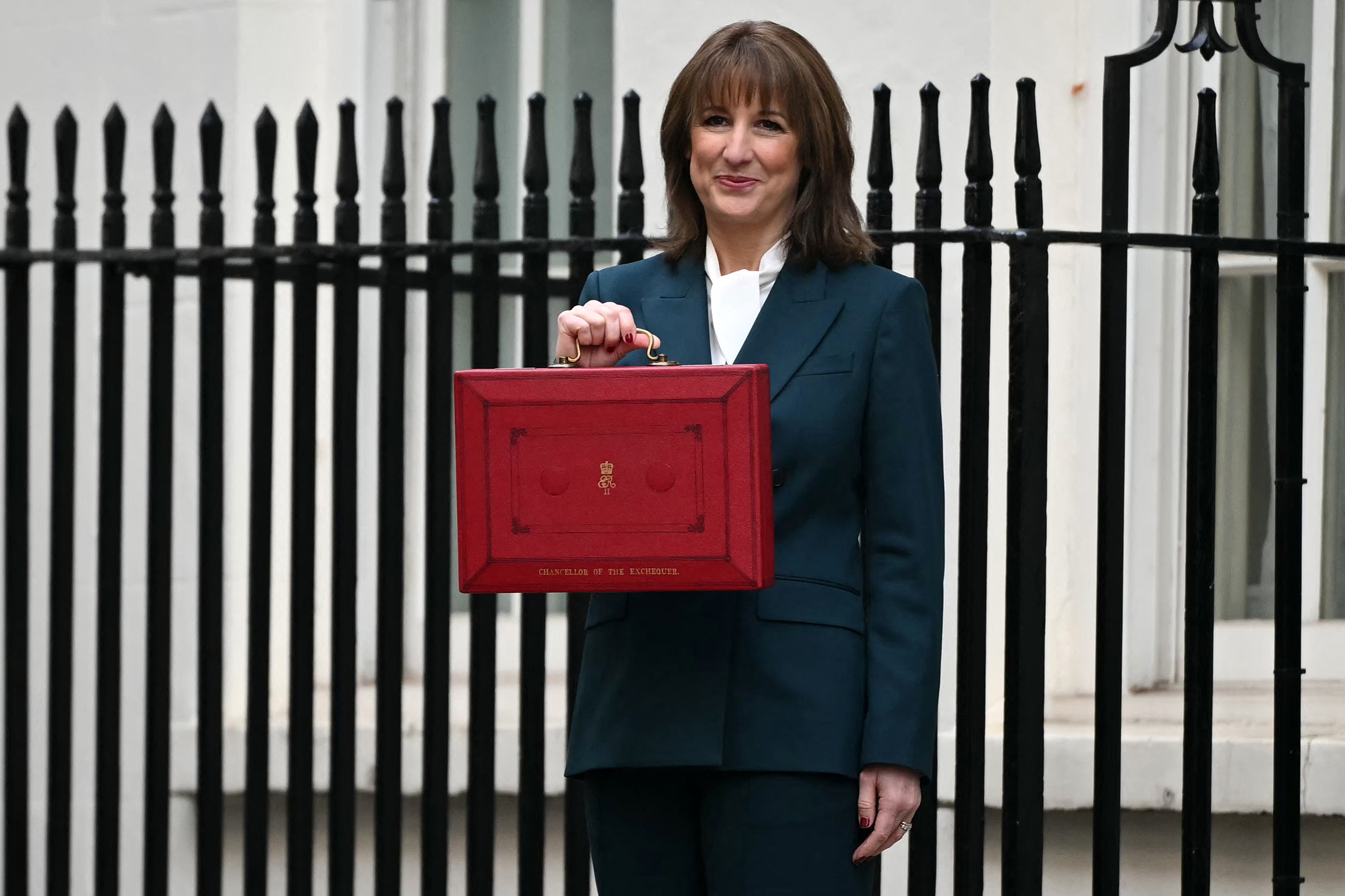 Britain's Chancellor of the Exchequer Rachel Reeves poses with the red Budget Box