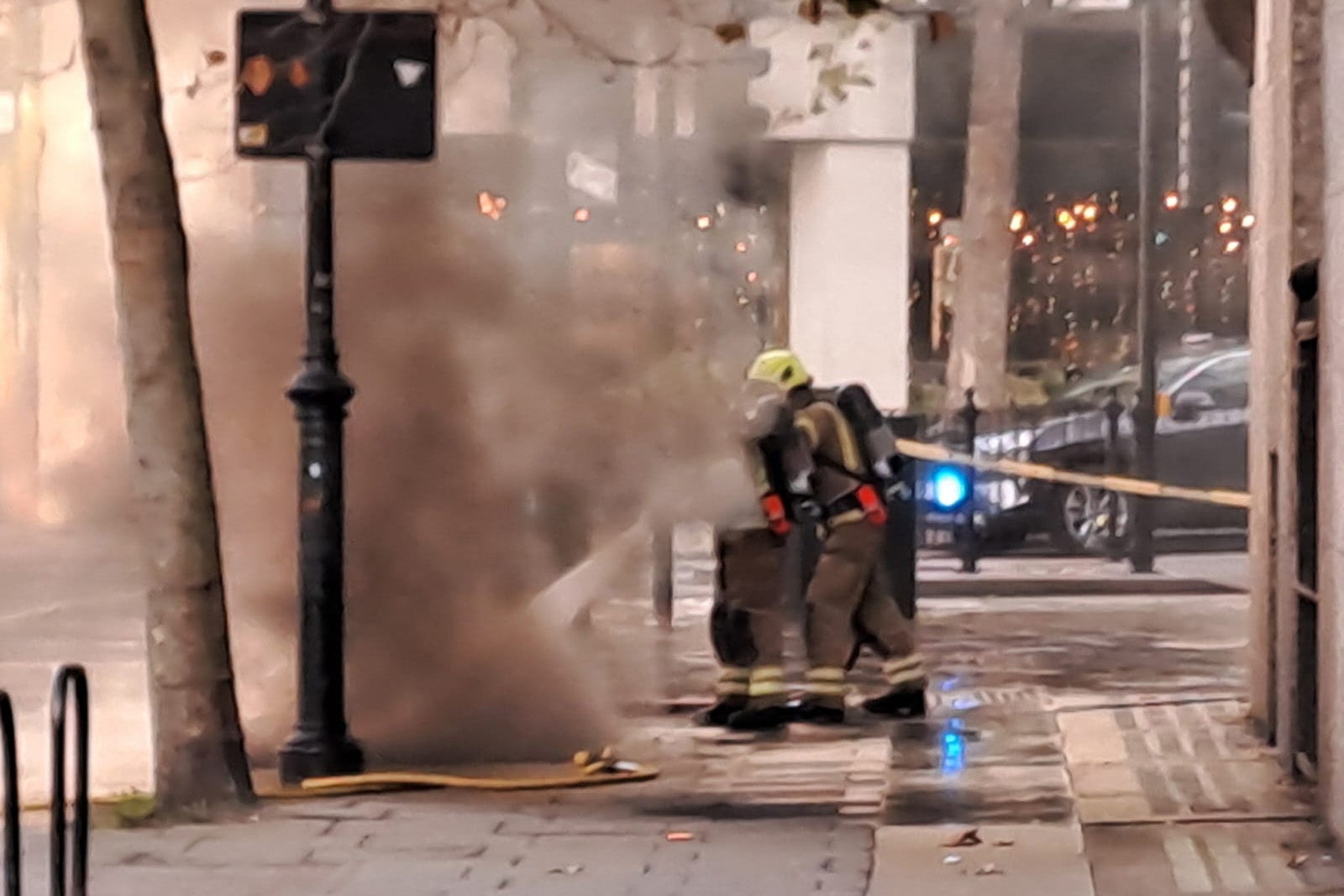 Dozens of firefighters are tackling a blaze in an underground tunnel in central London