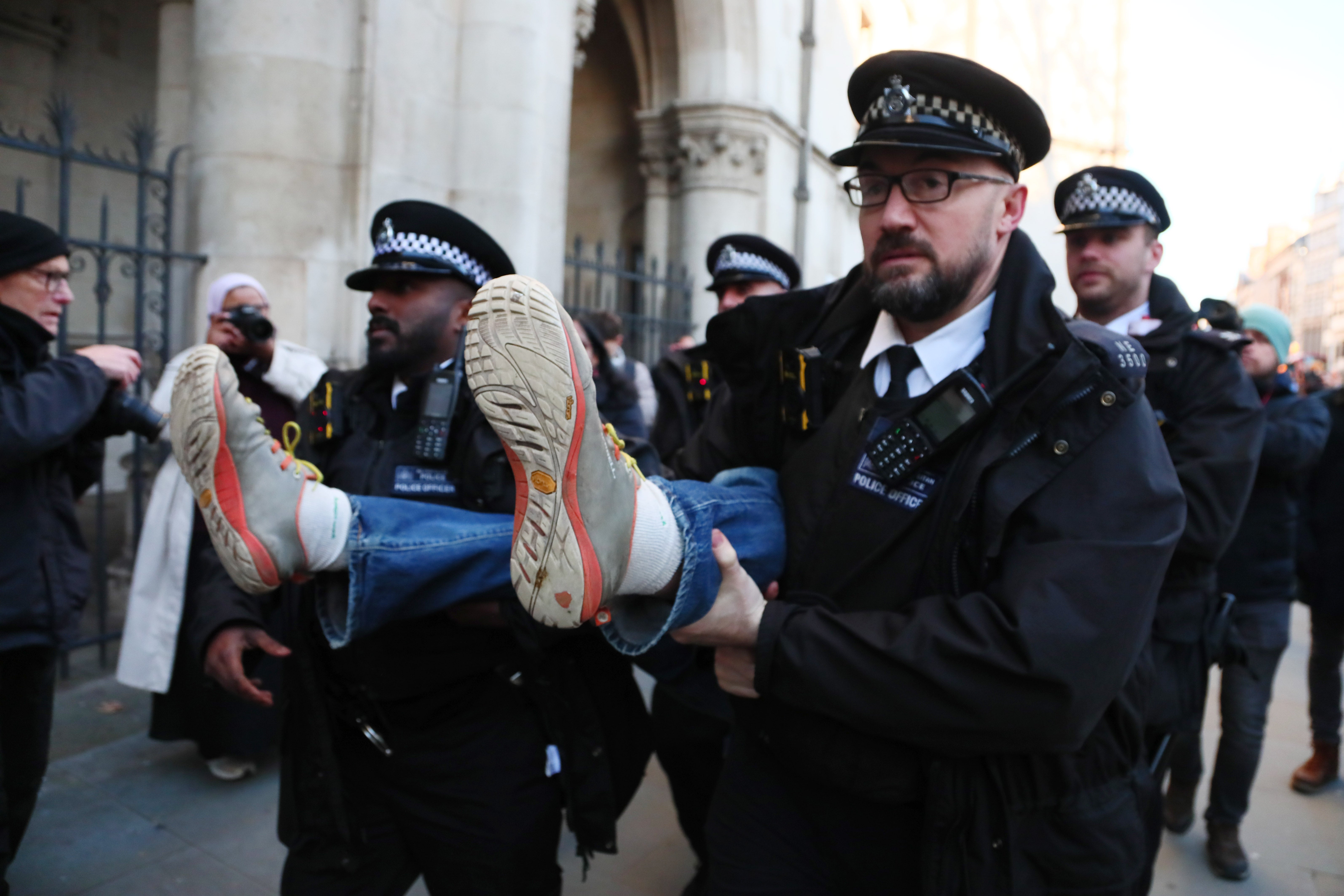 Police detaining a protester outside The Royal Courts of Justice in November as the High Court heard a judicial review on the proscription of Palestine Action under the terrorism act