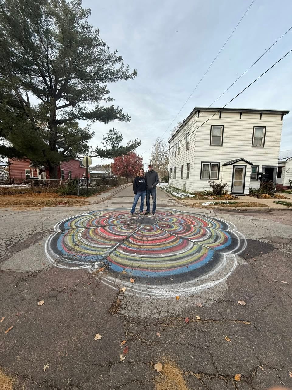 Artist Brandon Bradshaw was arrested after painting vibrant paintings on manhole covers in Sioux City, Iowa.