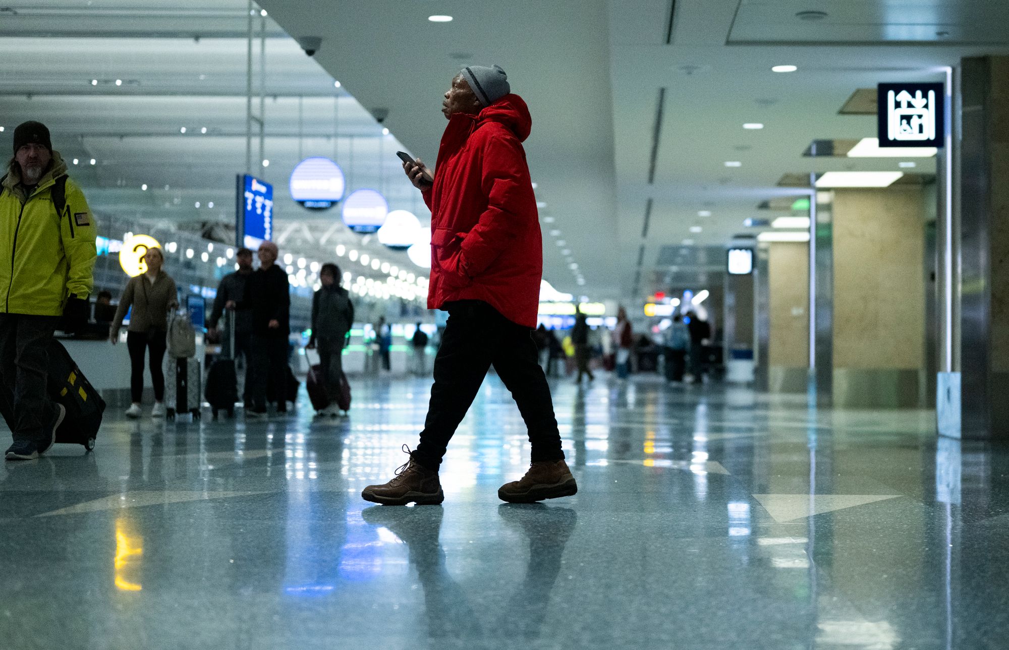 Travelers pass through Minneapolis-Saint Paul International Airport Wednesday. This Thanksgiving is expected to be the busiest for flying in nearly 15 years.