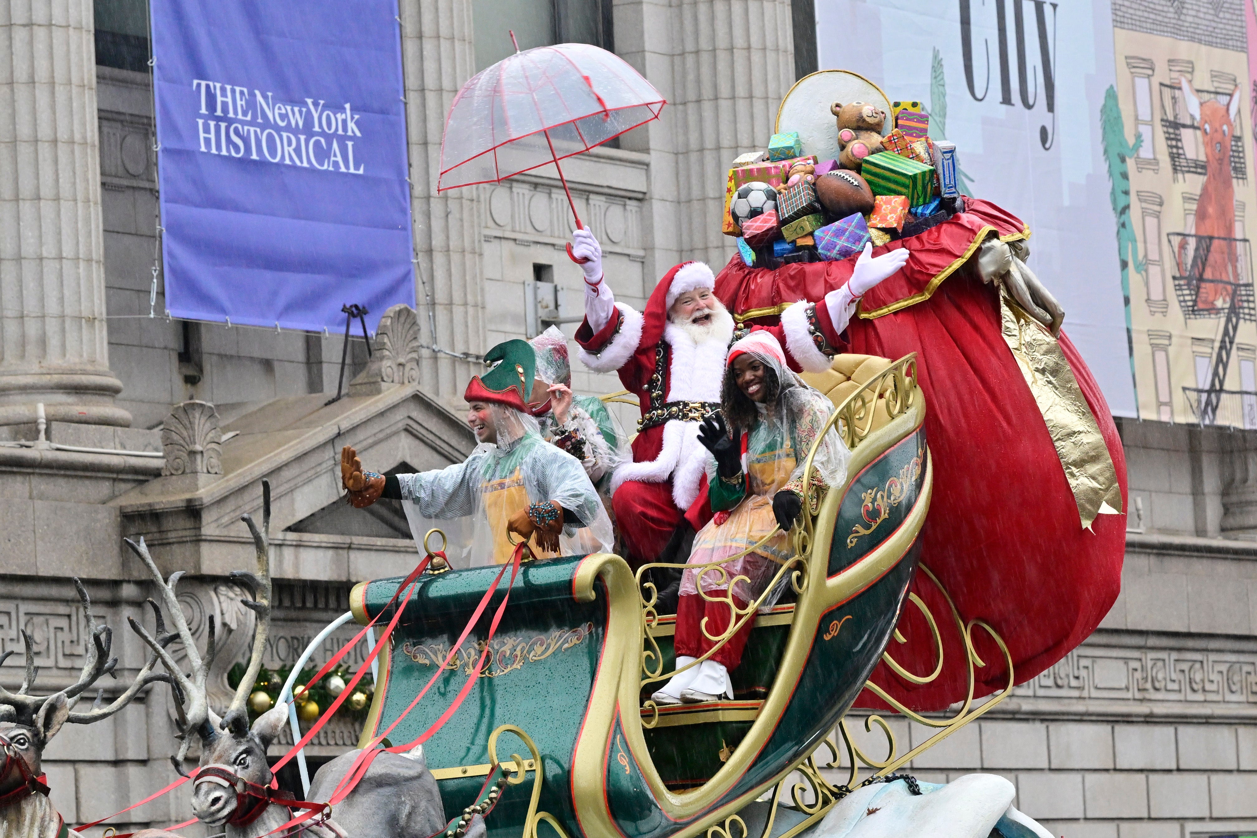 Santa Claus waves at onlookers from his sleigh during the 2024 Macy's Thanksgiving Day Parade