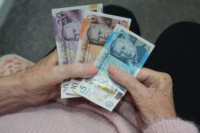 Workers saving into a pension nowadays are often bearing the risk as to how much money they will end up with in retirement (picture posed by model/Lucy North/PA Archive)