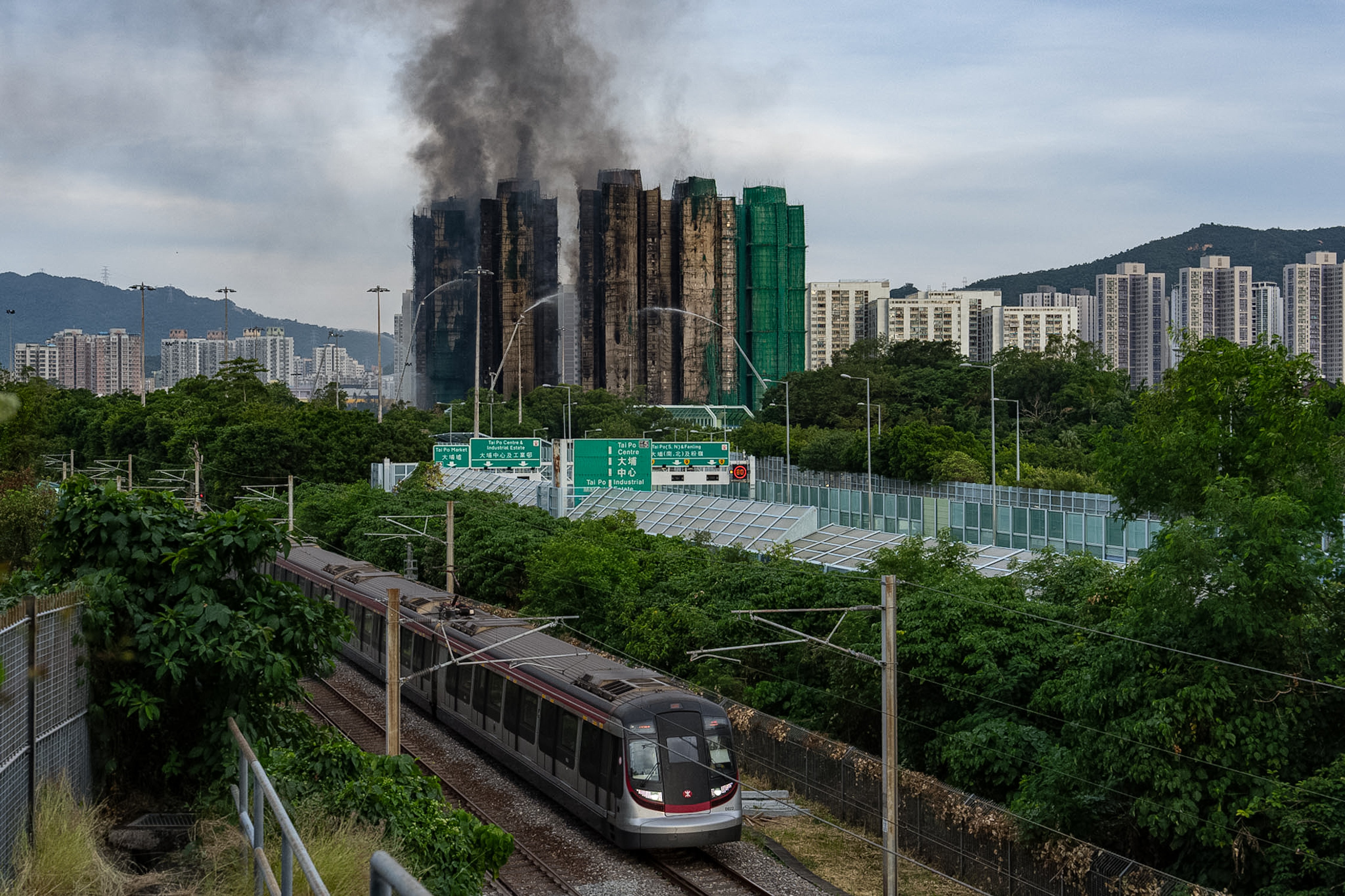 Smoke continues to rise on Thursday from the fire at Wang Fuk Court