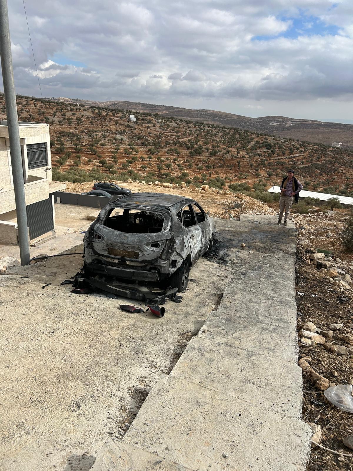 A burnt-out car in Taybeh following an attack on the town by Israeli settlers