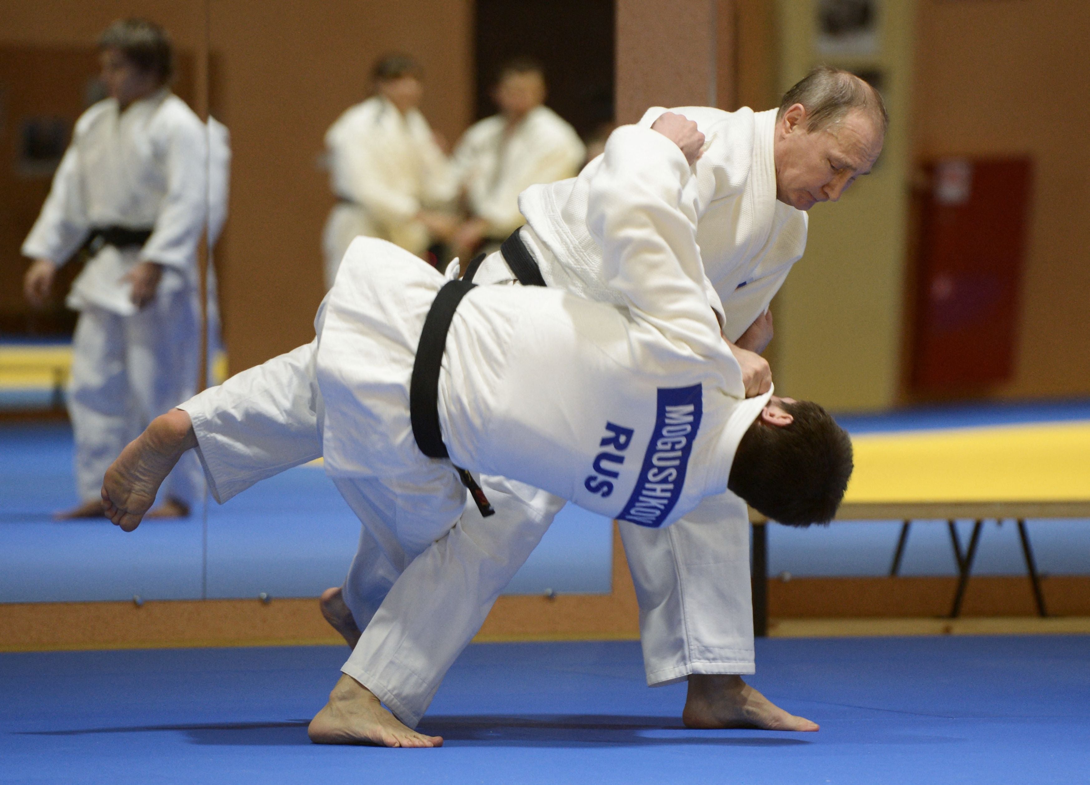 Putin flips a man in judo in on of the monthly images