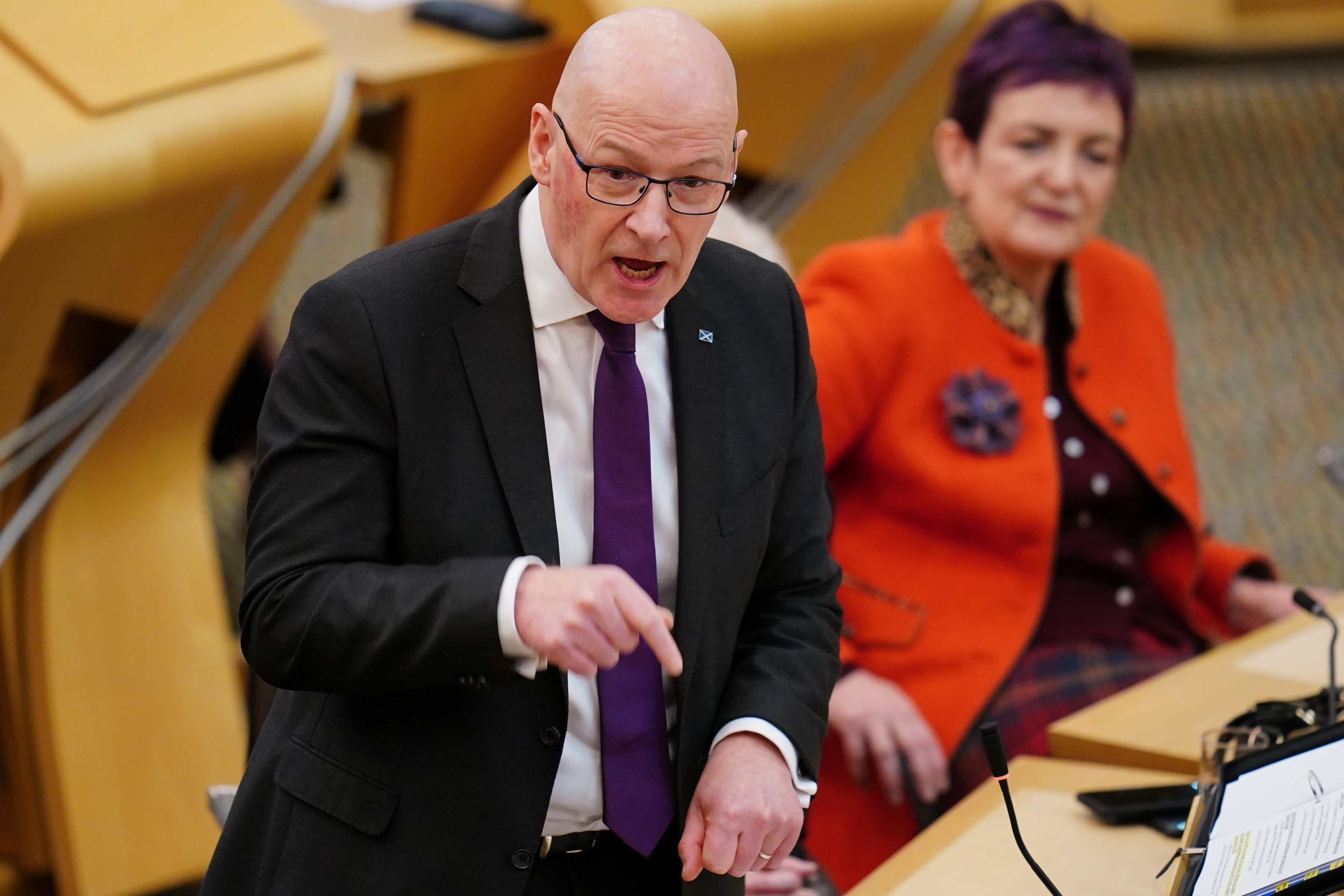 First Minister John Swinney branded protests outside asylum seeker hotels ‘racist’ (Jane Barlow/PA)