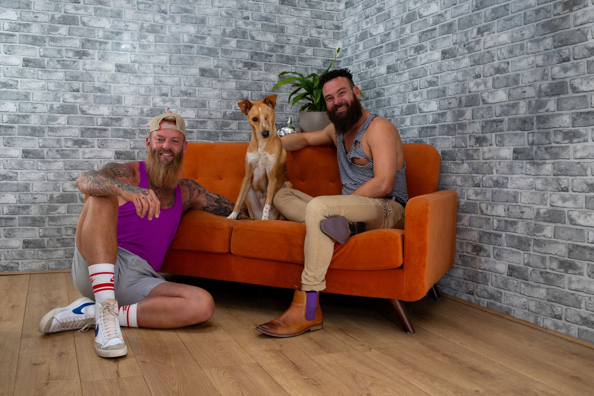 Leon, his partner Dean, and their rescue dog Tron