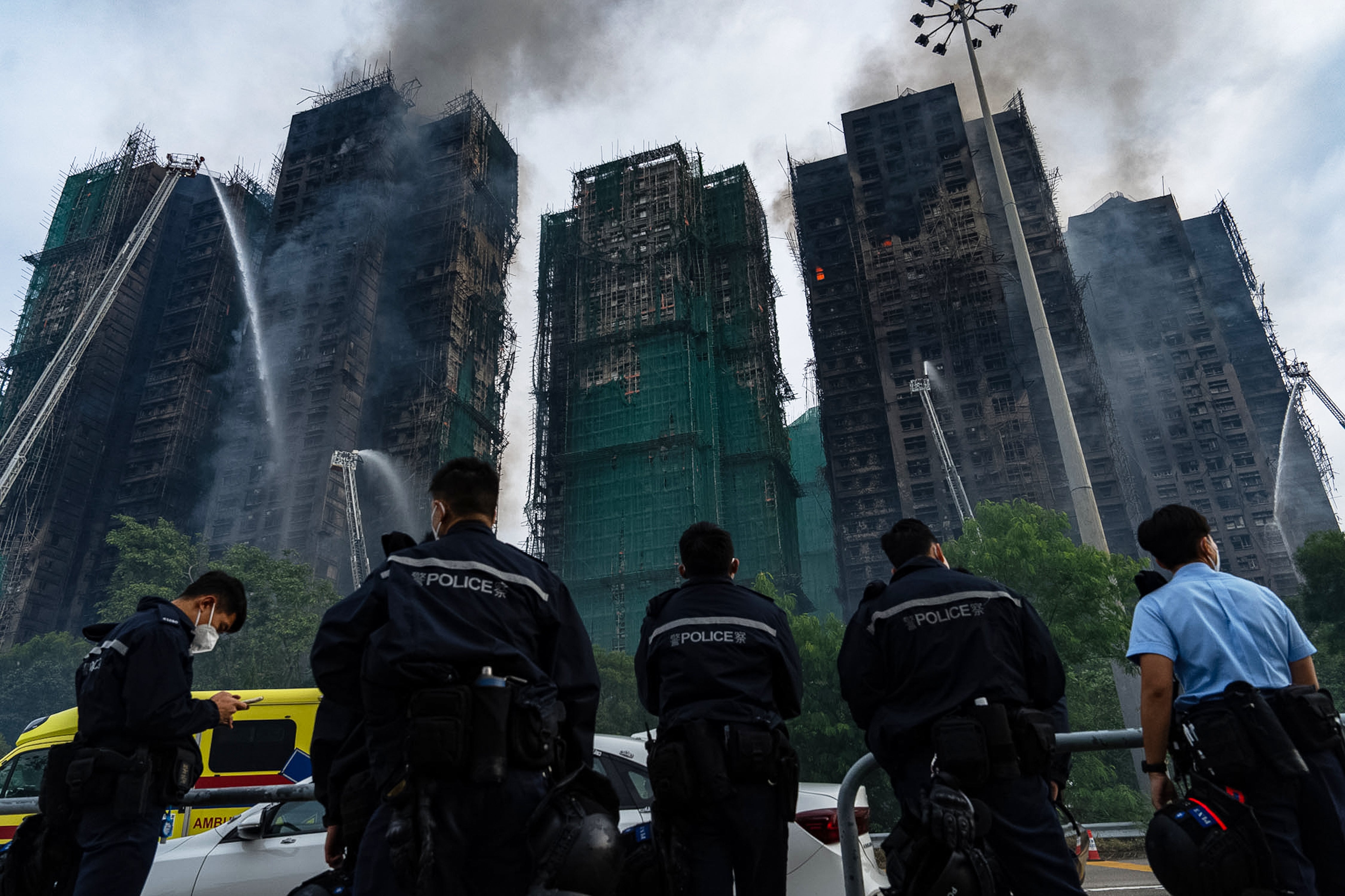 <p>Firefighters work to extinguish the fire at Wang Fuk Court in Hong Kong on Thursday</p>