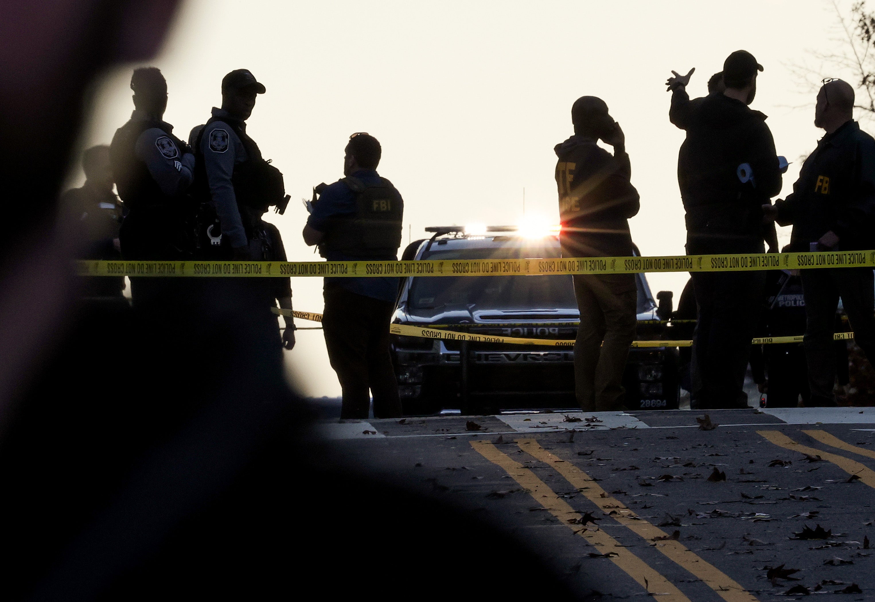 Members of law enforcement, including the U.S. Secret Service and the Washington Metropolitan Police Department, respond to a shooting near the White House on November 26, 2025 in Washington, DC