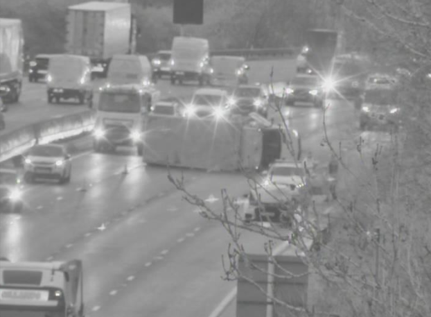 An overturned van on the M5 has caused traffic chaos for commuters