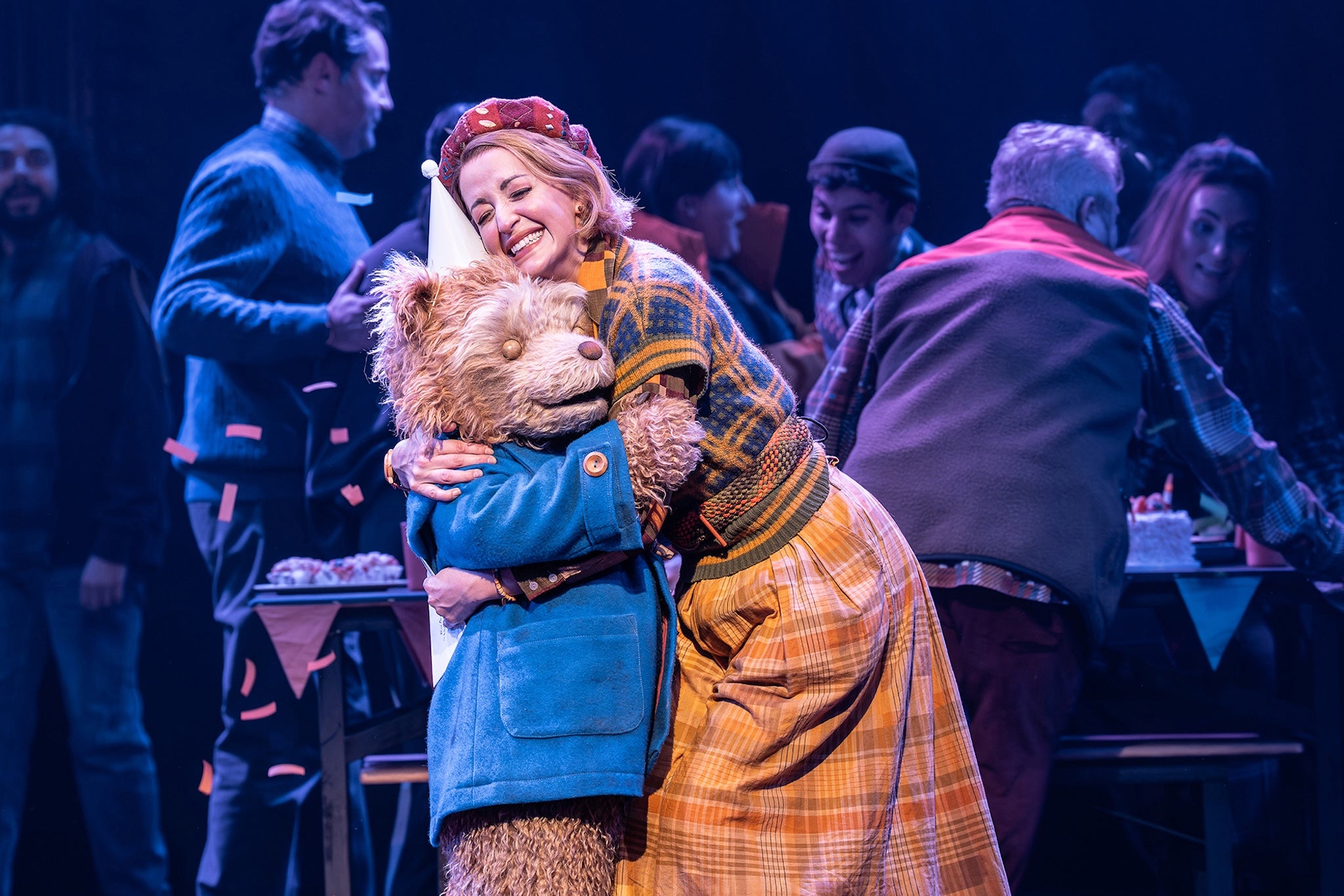 Bear hug: Paddington and Mrs Brown embrace on stage