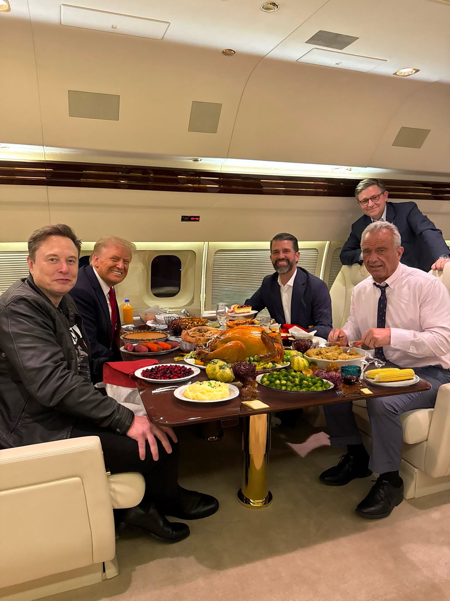Secretary Robert F. Kennedy Jr. was ridiculed for posting an altered photo of himself, President Donald Trump, Donald Trump Jr., Elon Musk and House Speaker Mike Johnson enjoying a Thanksgiving meal