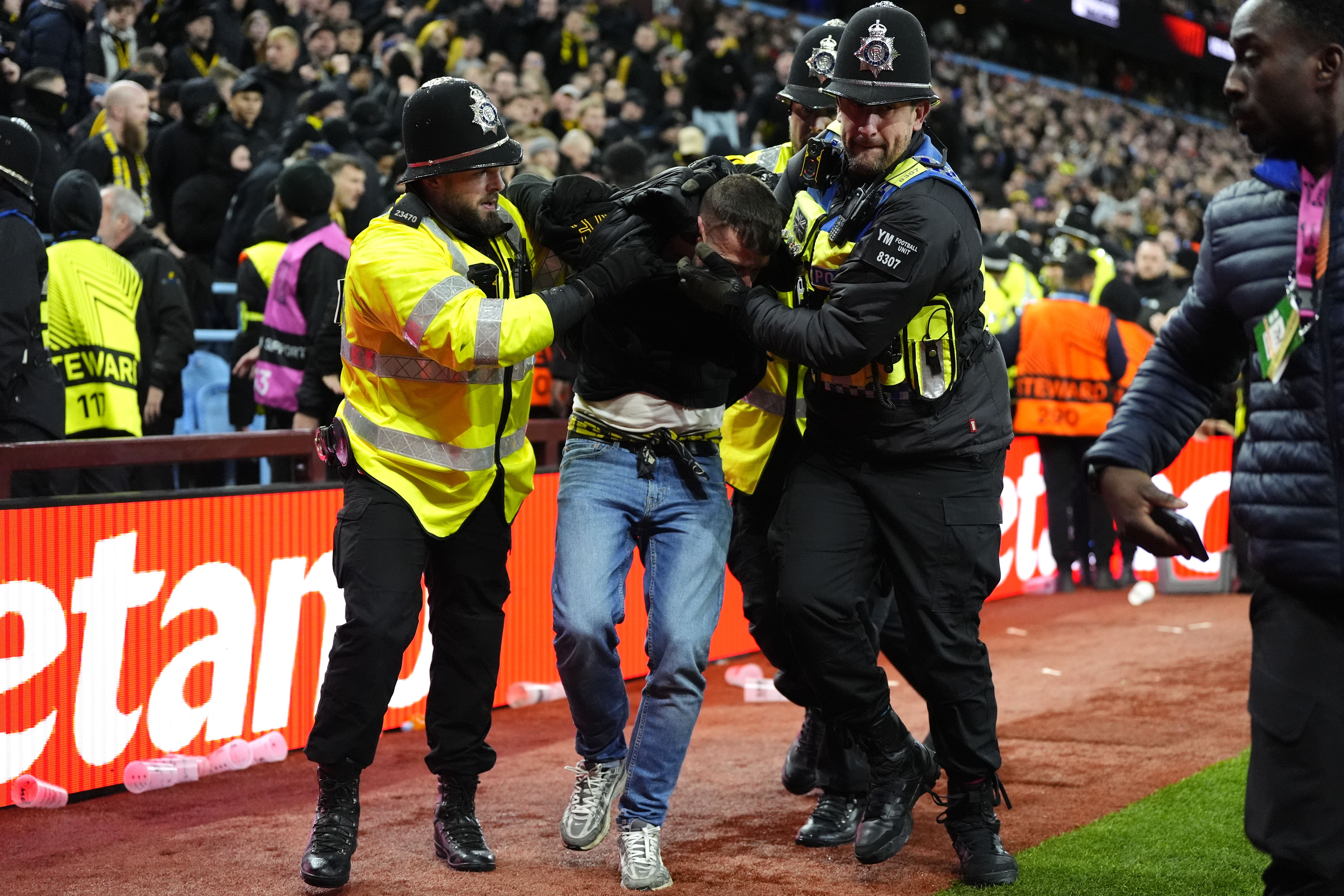 A Young Boys fan is escorted from the stadium by police during the UEFA Europa League, league phase match at Villa Park, Birmingham (Nick Potts/PA)