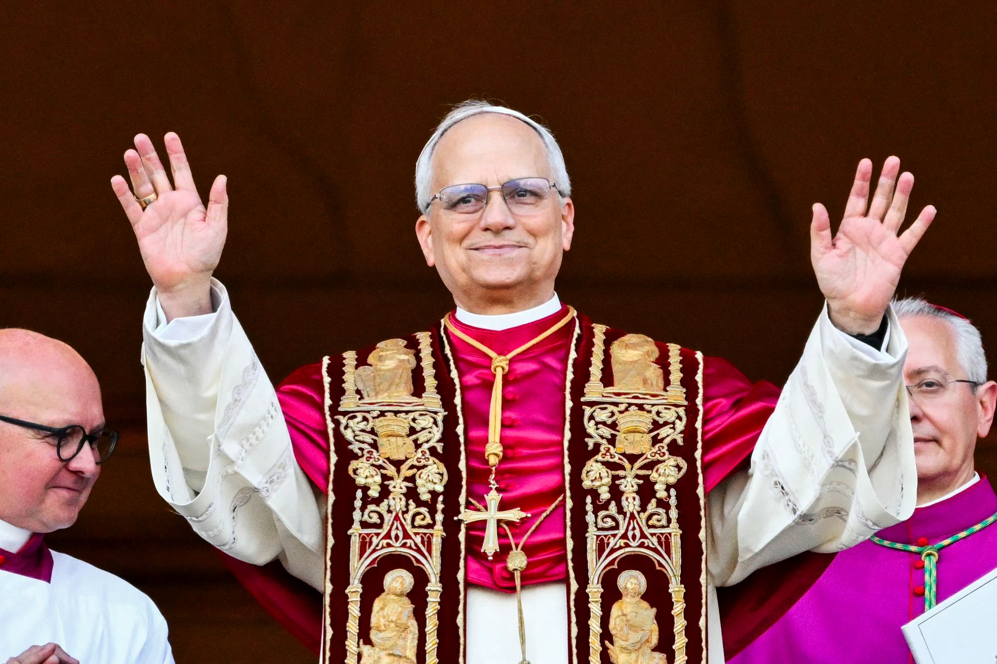 Pope Leo XIV, Robert Prevost, debuts on the main central loggia balcony of St Peter's Basilica for the first time, after the cardinals ended the conclave
