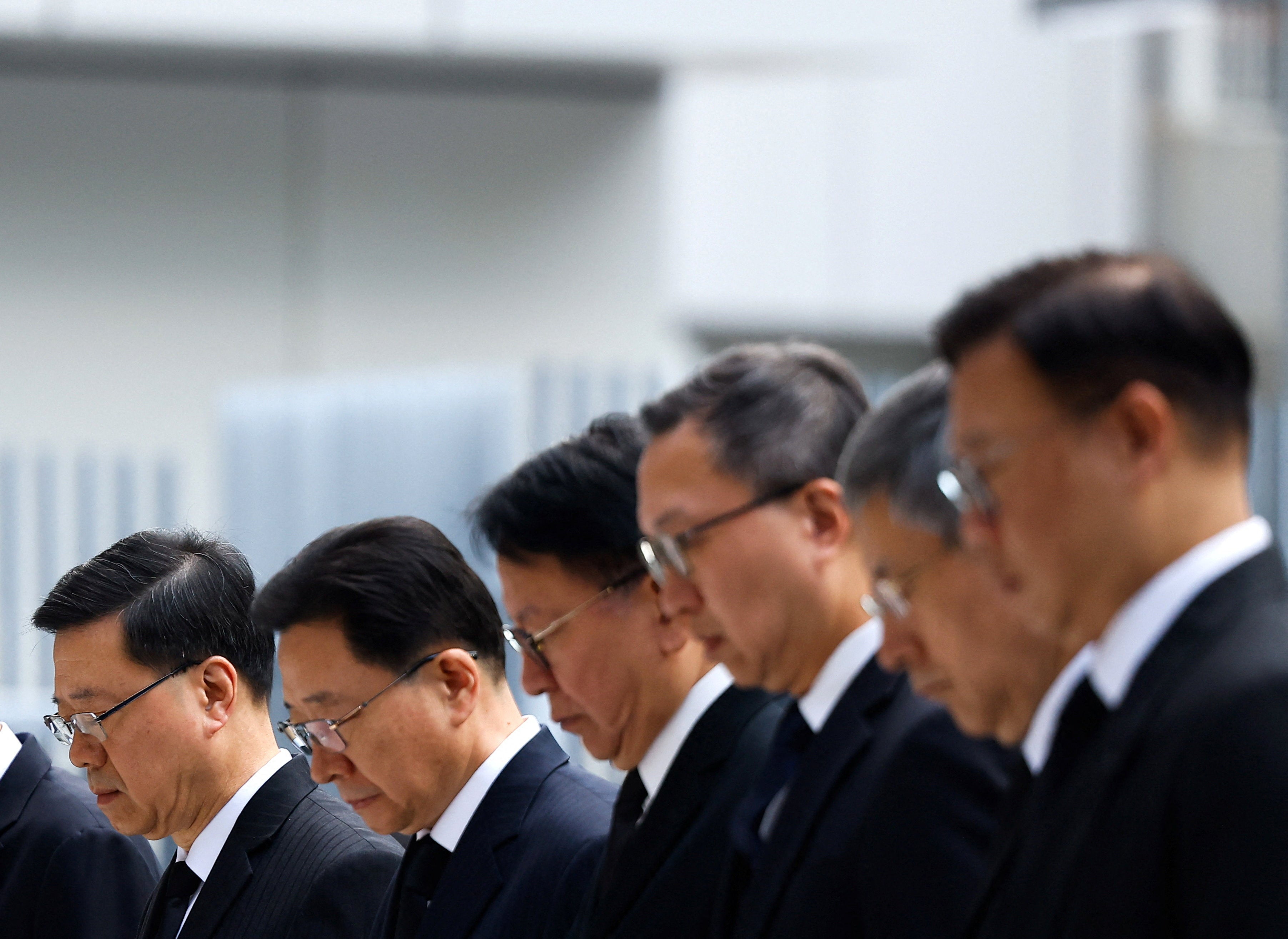 Officials including Chief Executive of Hong Kong John Lee attend a ceremony at the Central Government Offices of Hong Kong to mourn victims killed in the deadly fire