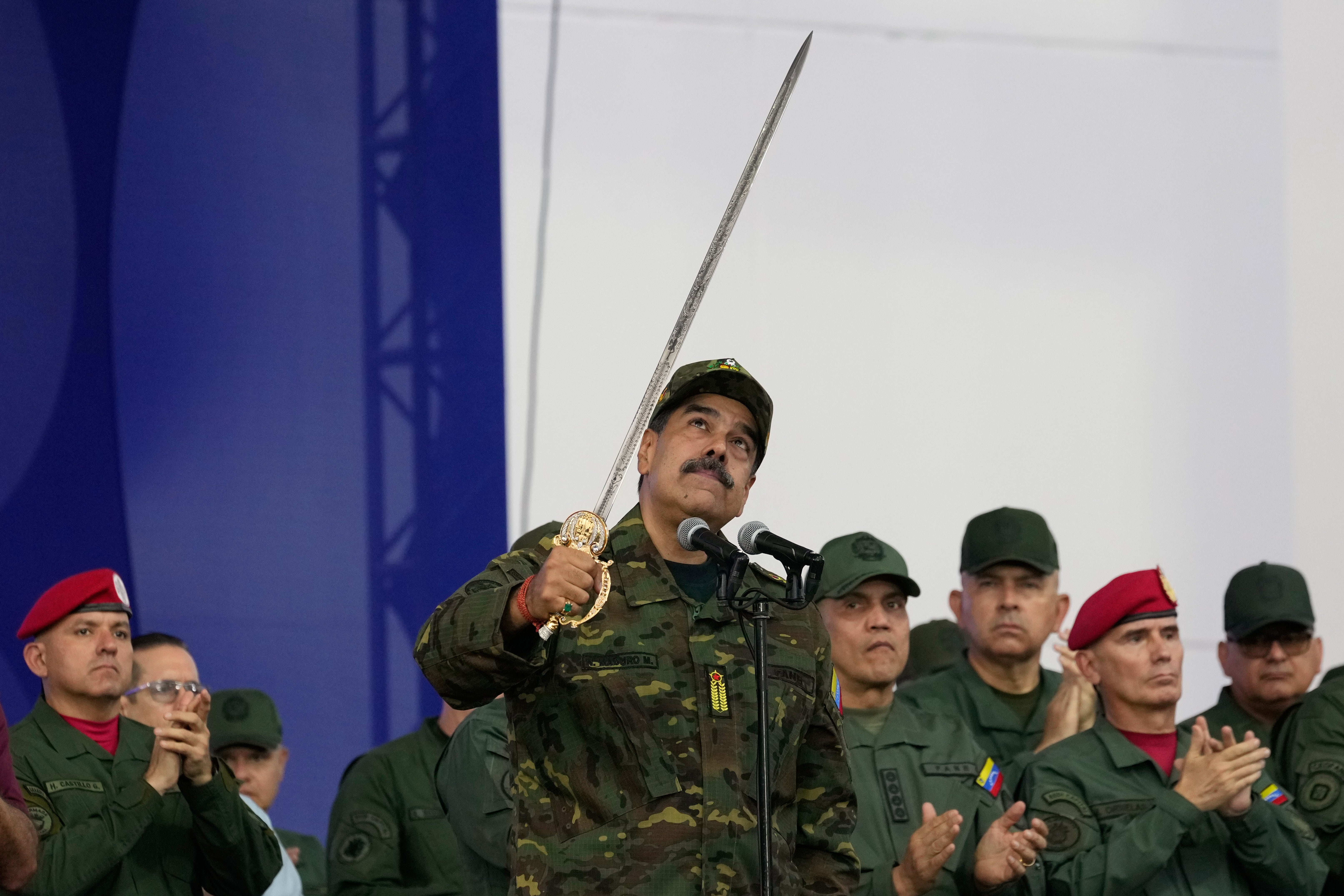 President Maduro brandishes a sword said to have belonged to independence hero Simon Bolivar