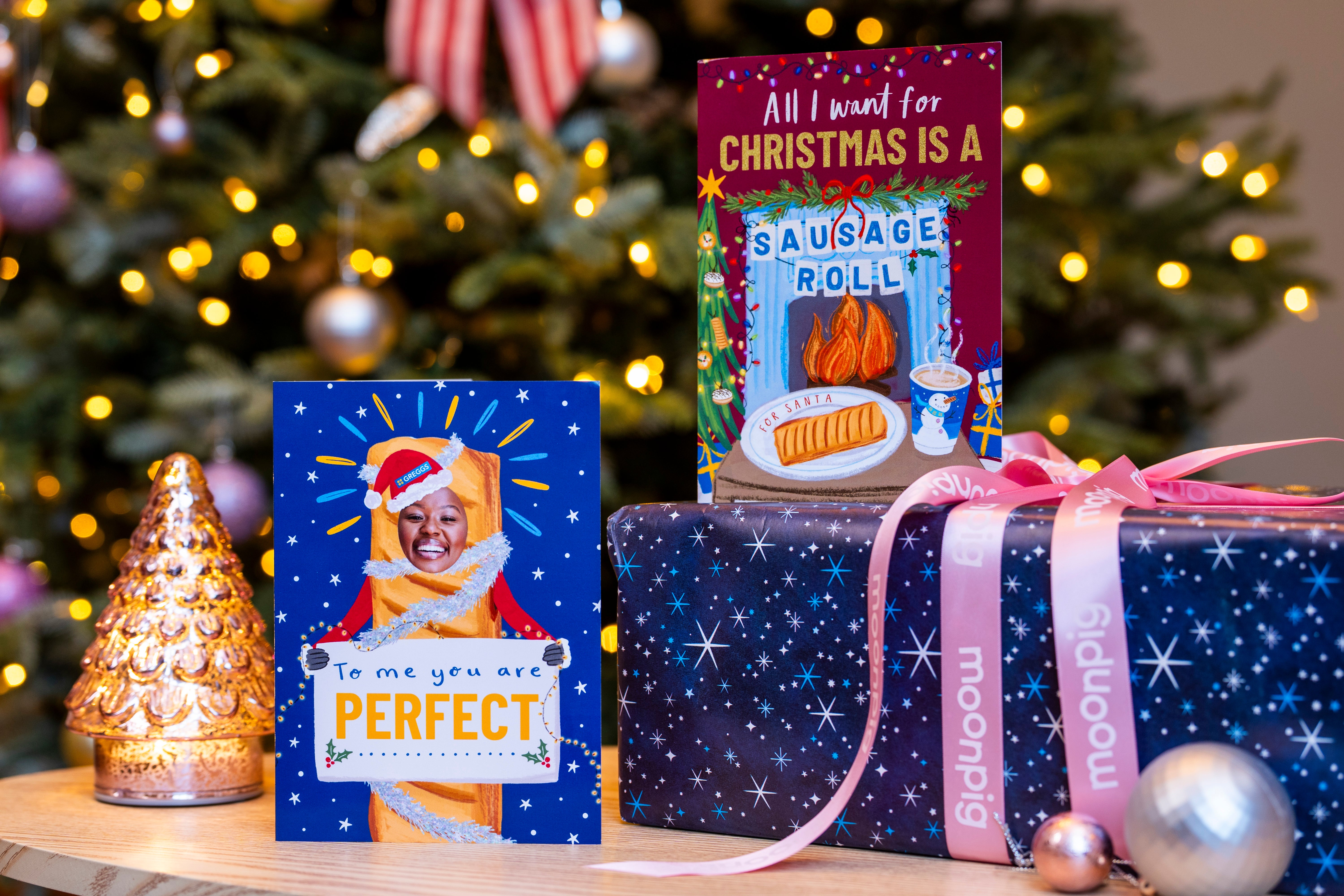 <p>High street baker Greggs is launching its first range of Christmas cards that come complete with the gift of a sausage roll</p>