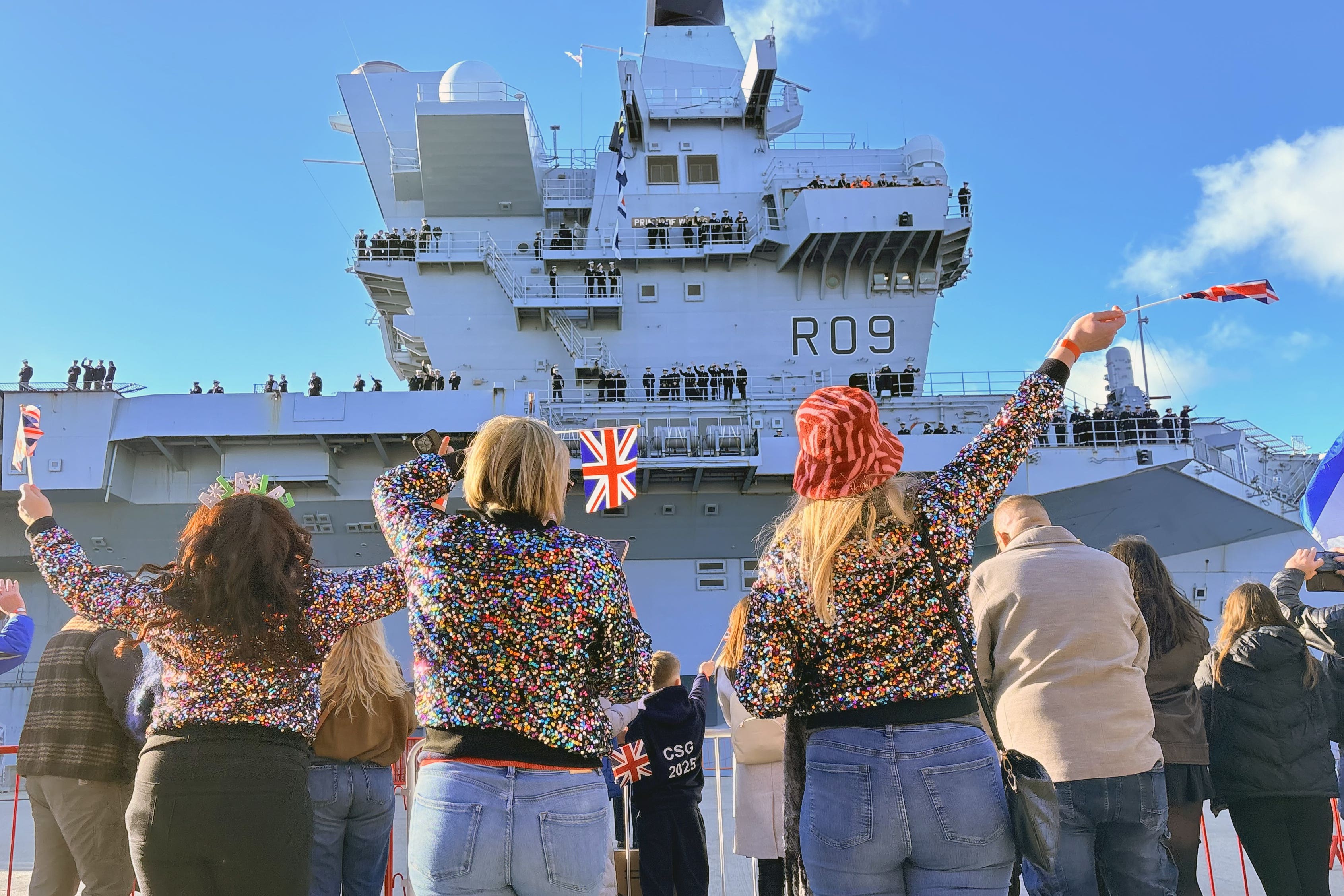 Friends and family wave as HMS Prince of Wales returns to Portsmouth Naval Base (Ben Mitchell/PA)