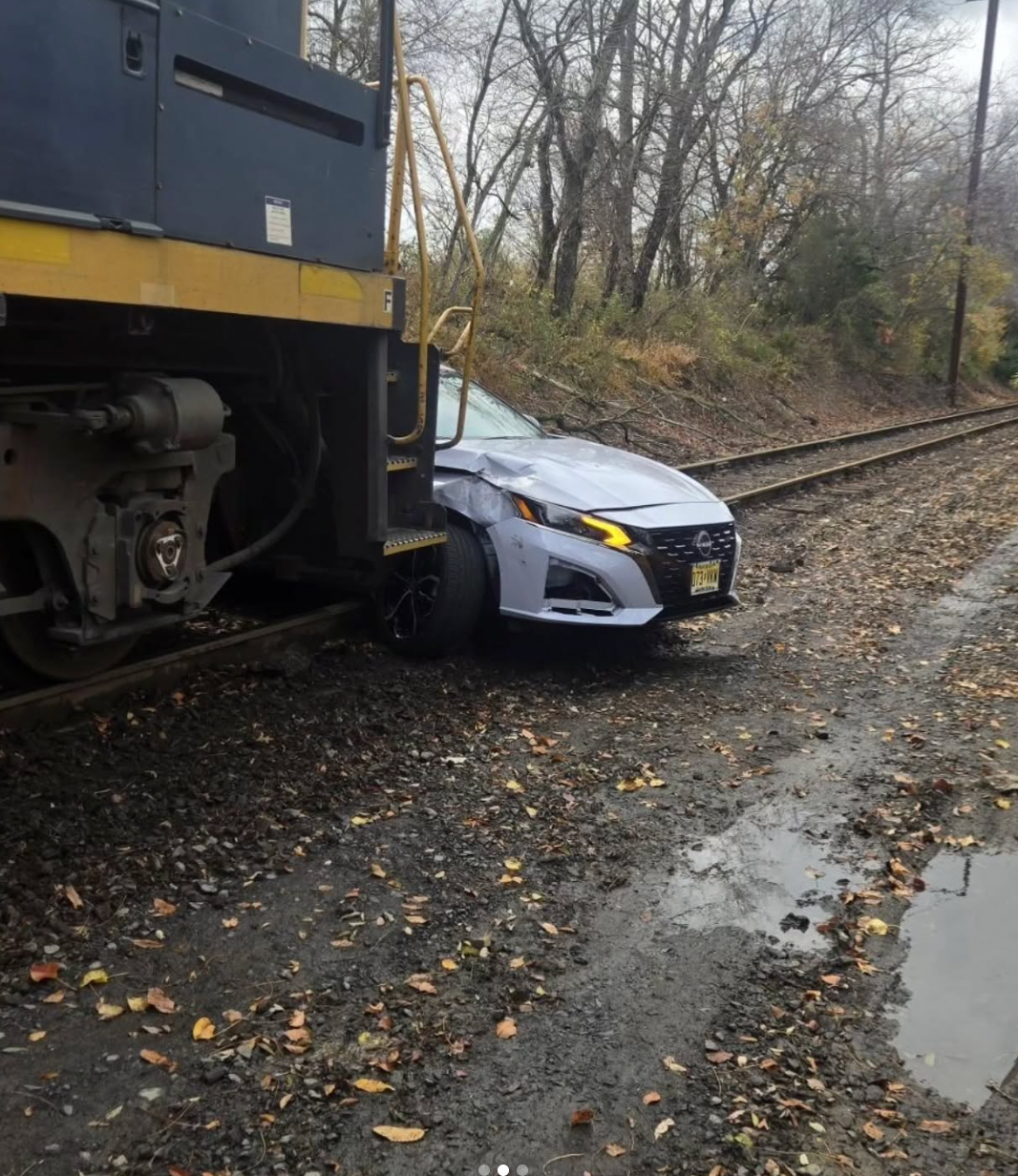 Photos released by South Brunswick police on social media show the vehicle sitting perpendicular across the rails as the train barrels towards it