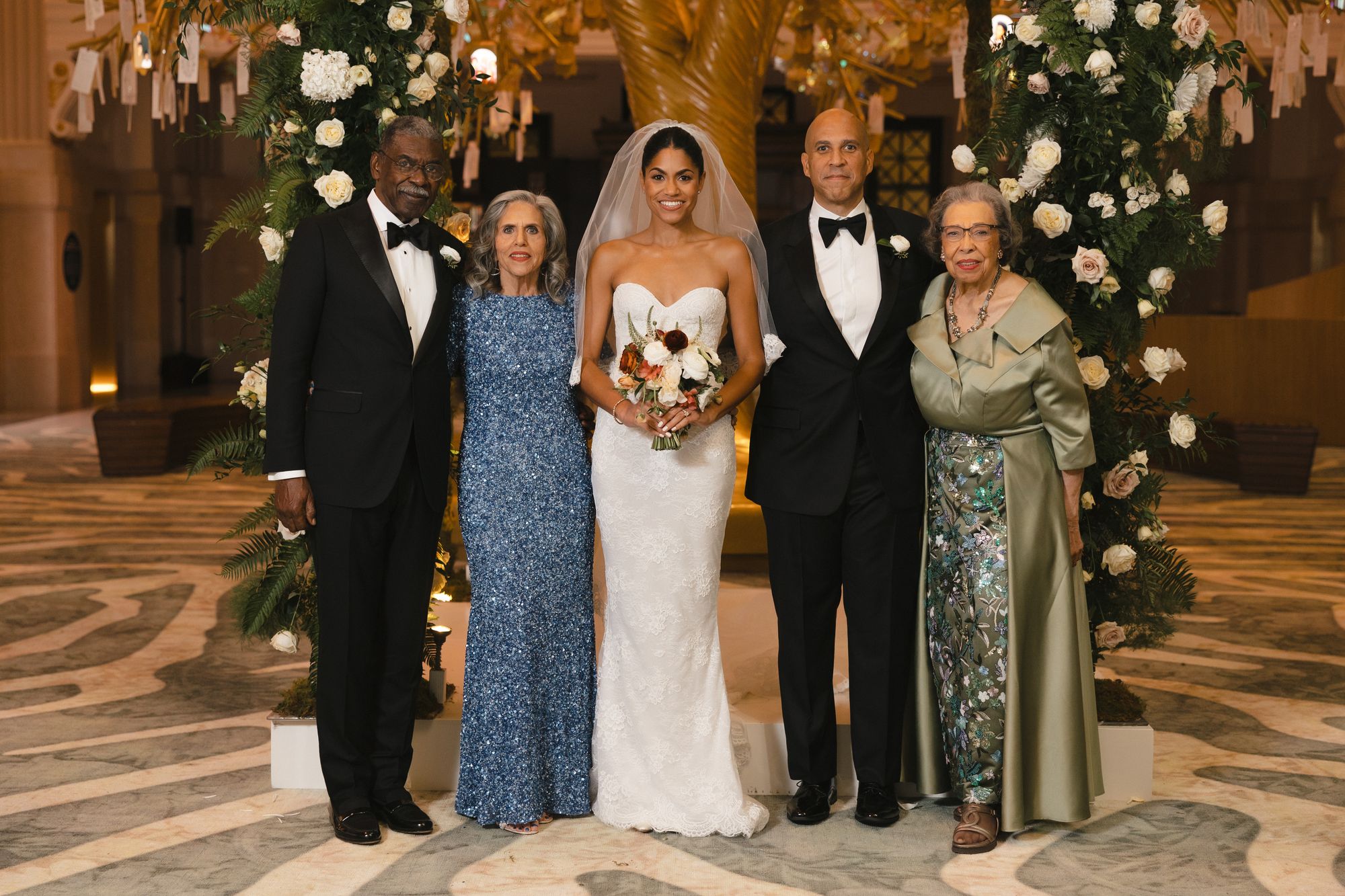 Booker and Lewis were legally married Monday at the federal courthouse in Newark, New Jersey, with their parents (pictured) as witnesses.