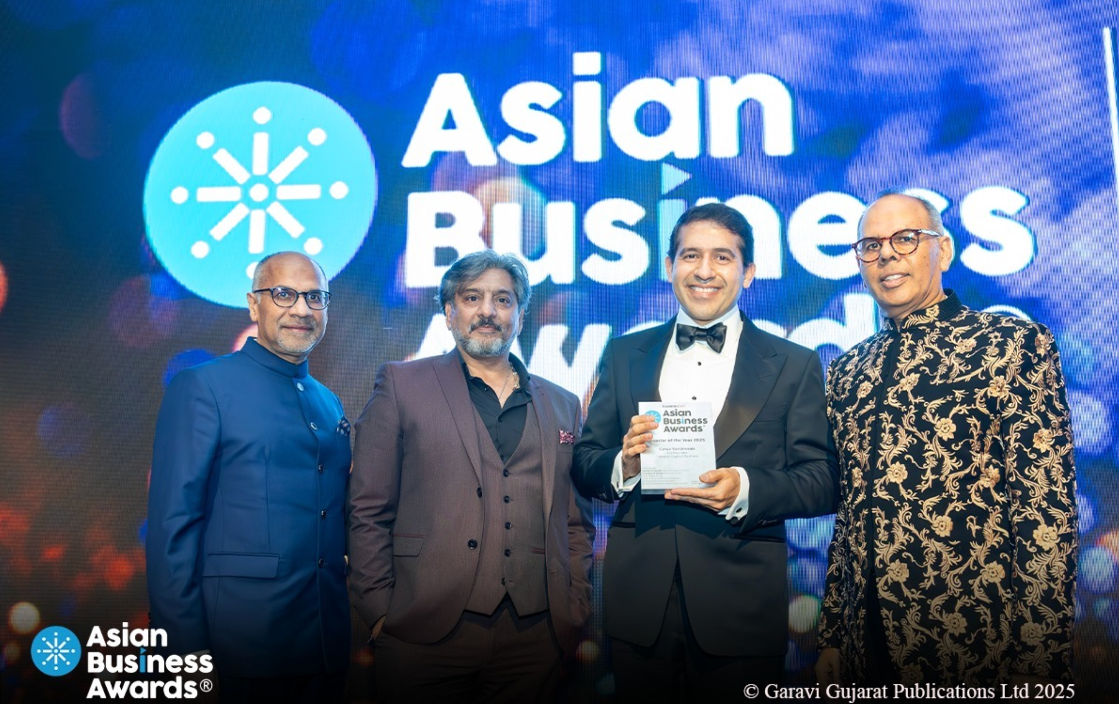 The investor and philanthropist (third from left), winner of the Asian Business Awards Investor of the Year, announces donation to The Independent’s SafeCall campaign
