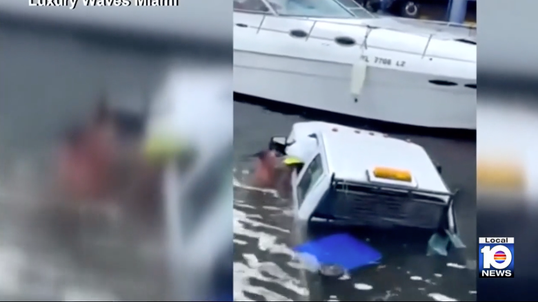 Two heroic bystanders jumped into the Miami River on Monday to save two women after their truck crashed into the water