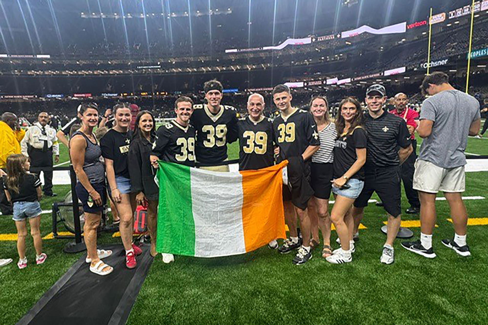Charlie Smyth (wearing headband) with family and friends after his Saints debut at the Hard Rock Stadium (Brendan Monaghan/PA handout)