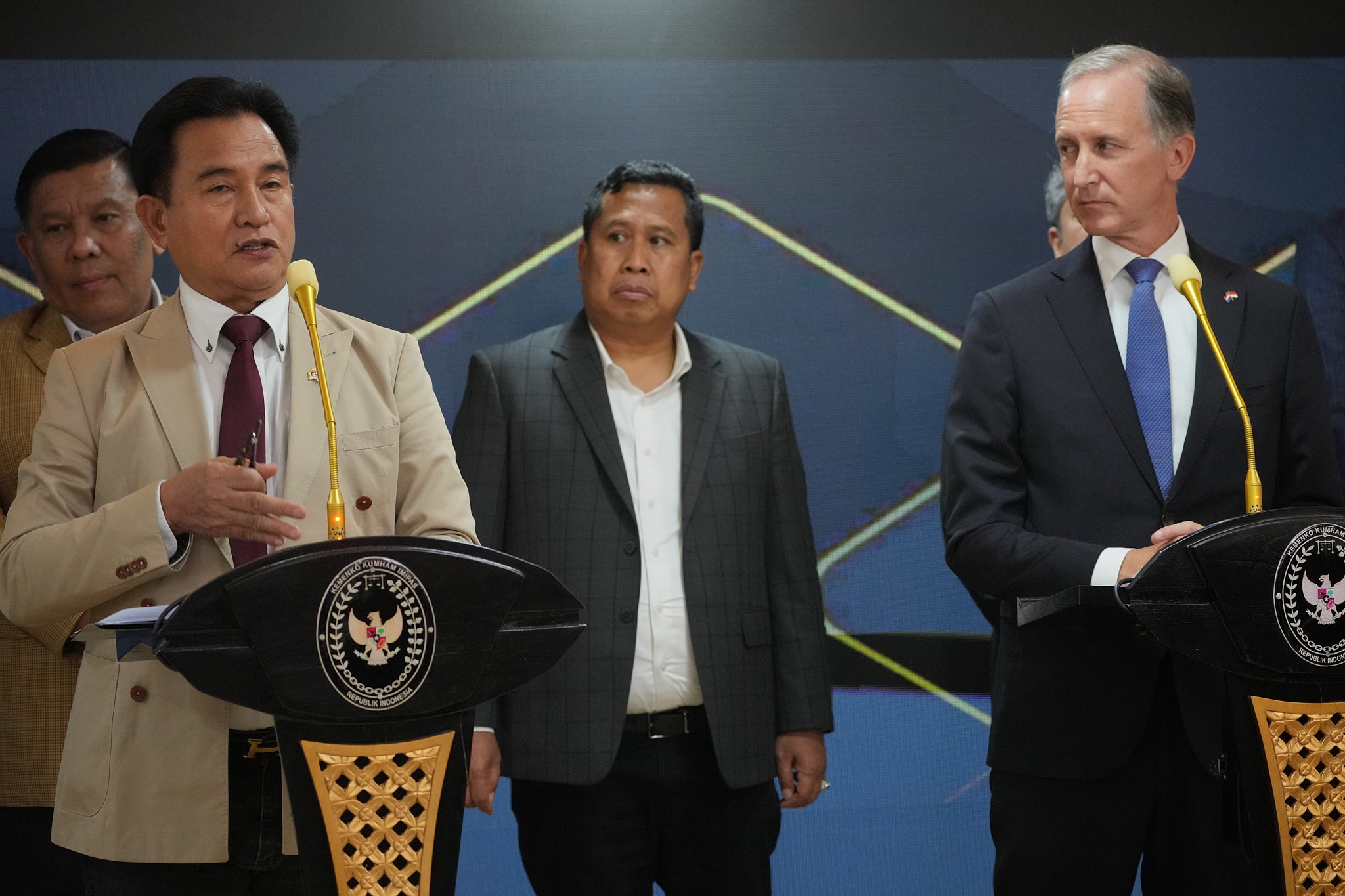 Indonesia's Coordinating Minister for Legal, Human Rights, Immigration and Correctional Affairs Yusril Ihza Mahendra, left, speak and Netherlands Ambassador to Indonesia Marc Gerritsen, listen, during a press conference after the signing ceremony the practical arrangement between the government of Indonesia and Netherland in Jakarta, Indonesia, Tuesday