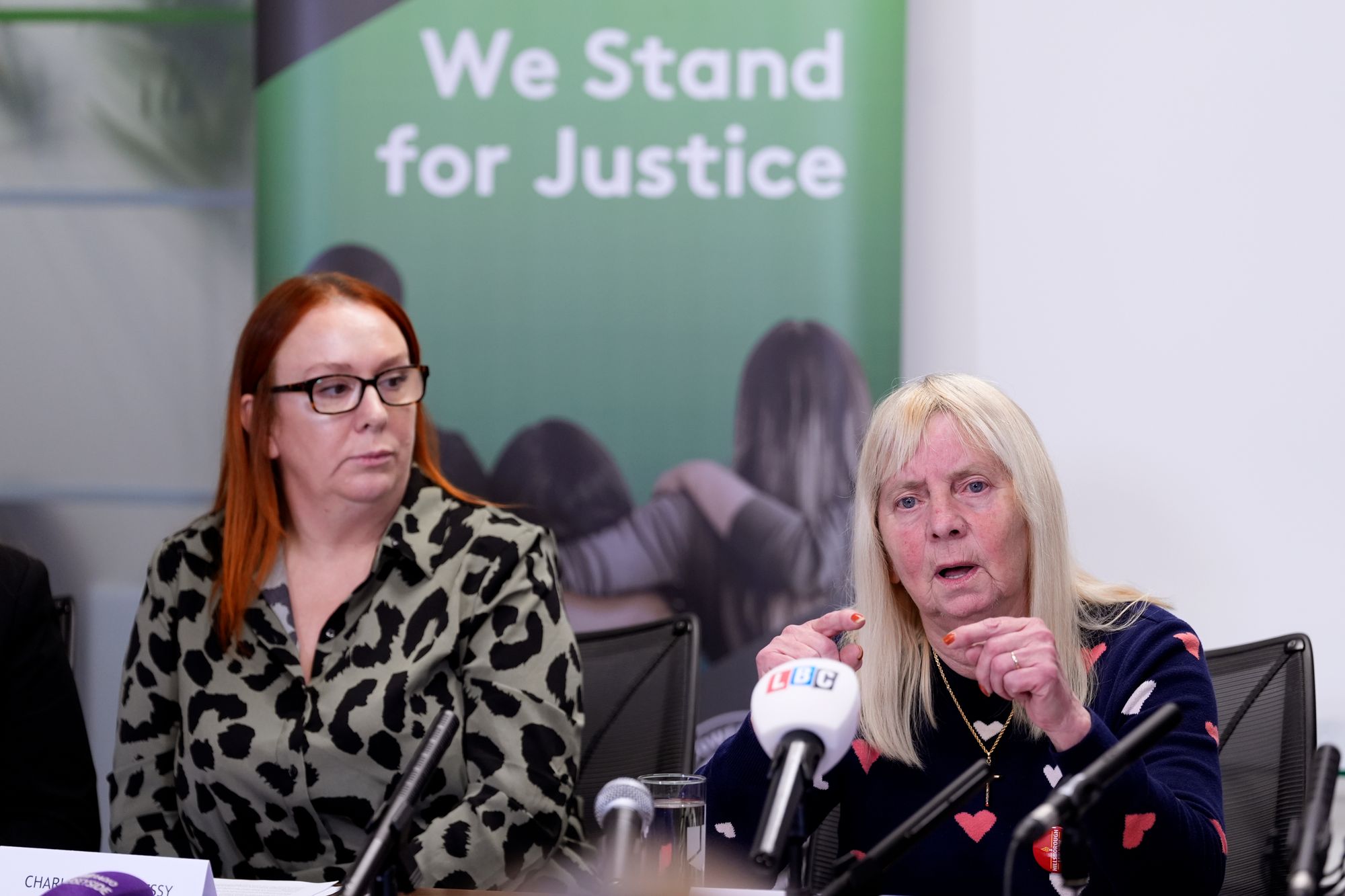 Charlotte Hennessy (left), the daughter of 29-year-old Jimmy Hennessy, and Margaret Aspinall, the mother of 18-year-old James Aspinall, during a press conference on Tuesday