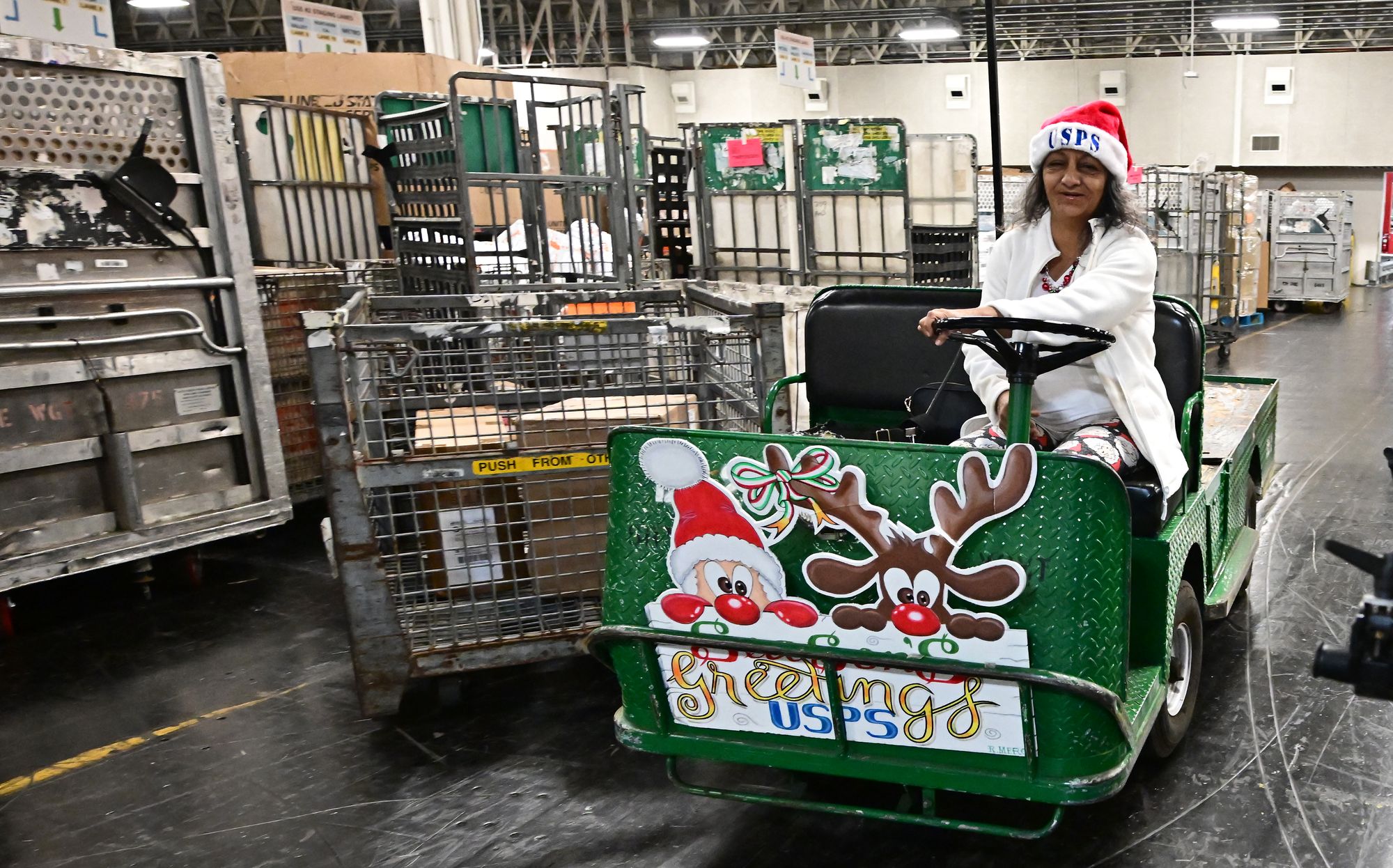 The Postal Service has opened hundreds of facilities and plans to hire thousands of seasonal workers to manage the influx of packages