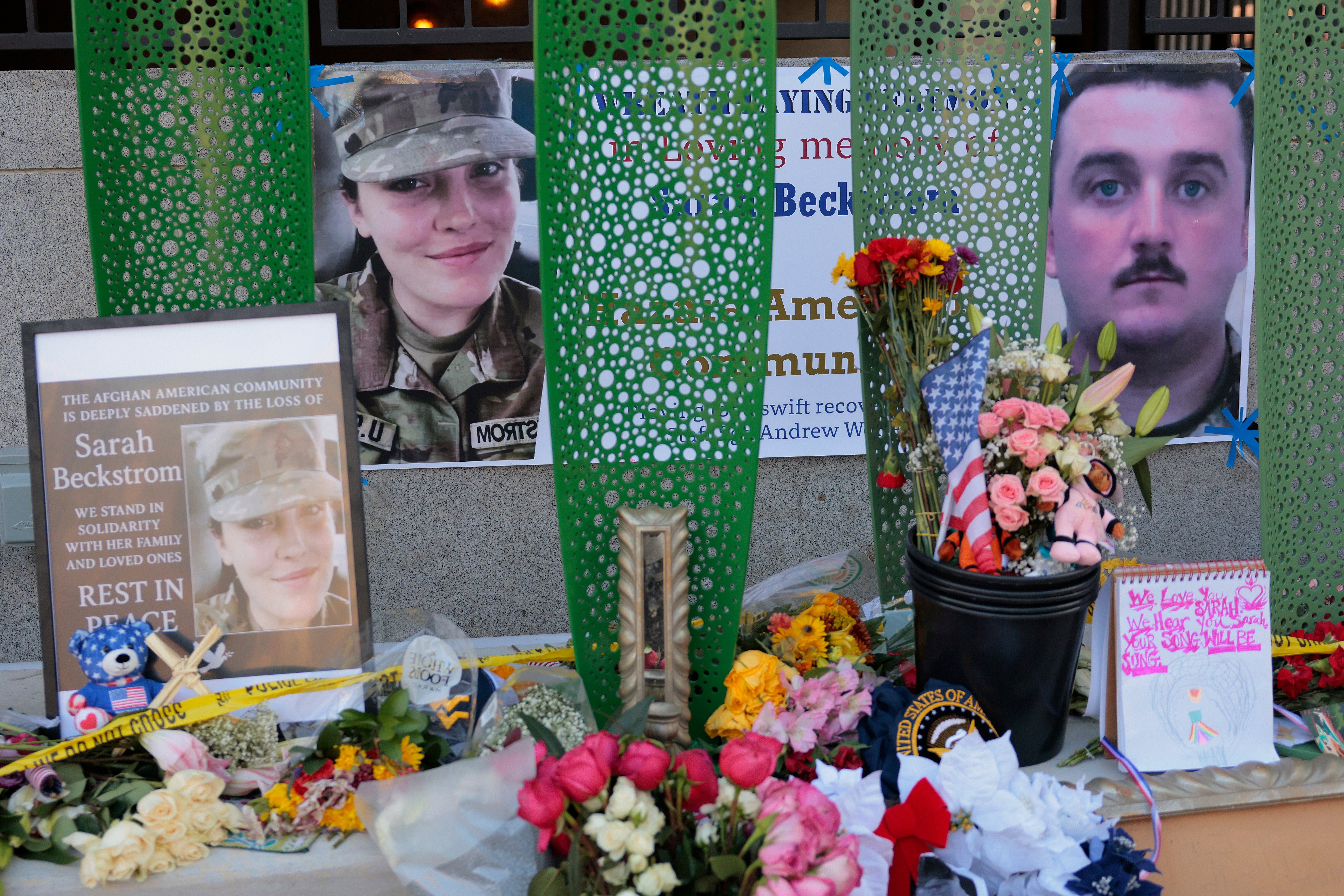 A makeshift memorial in Washington, DC honors Sarah Beckstrom and Andrew Wolfe, the two West Virginia National Guard troops shot blocks from the White House. Beckstrom was killed and Wolfe remains in a serious condition