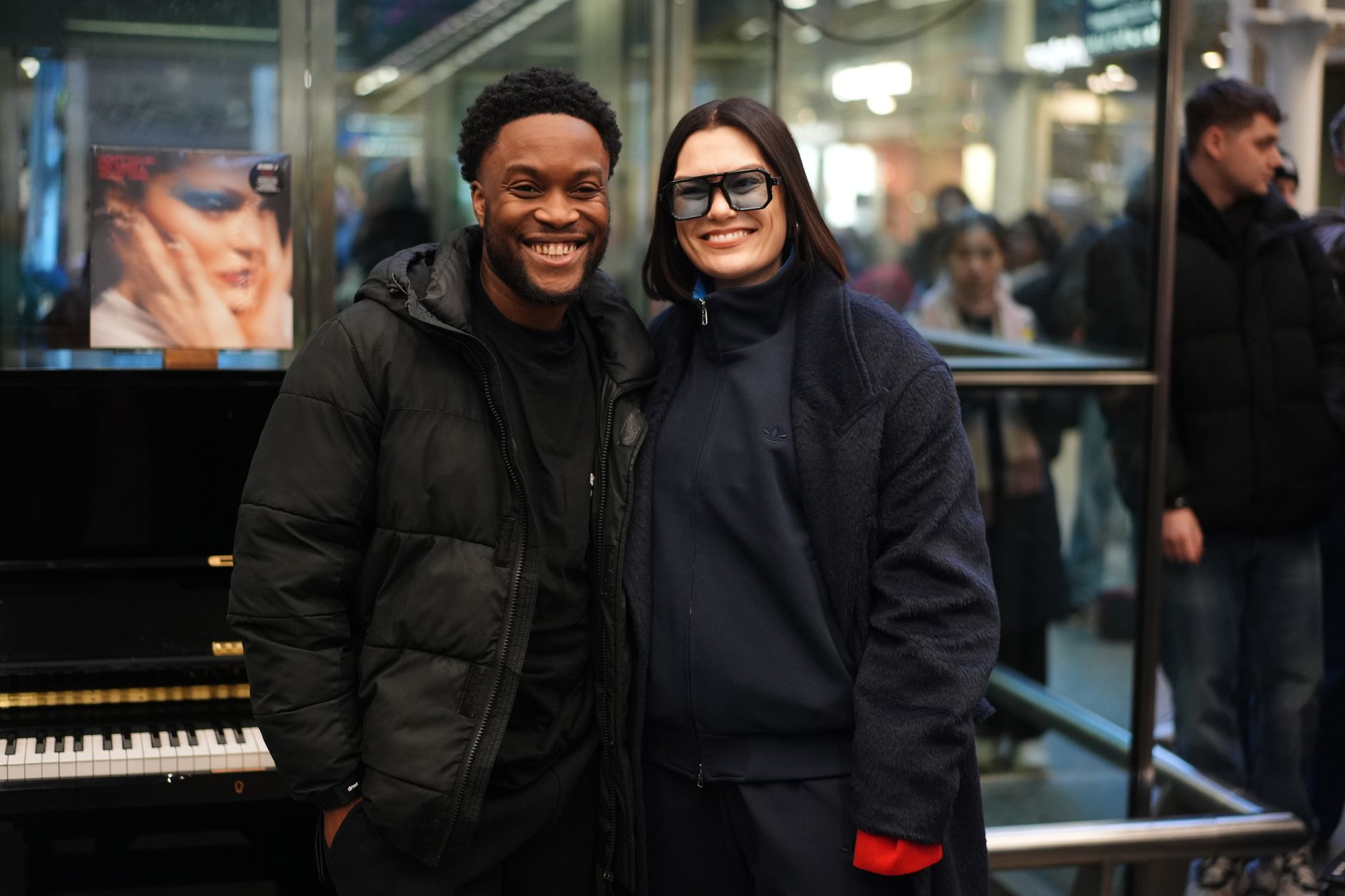 Pianist Jeffrey James with Singer Jessie J who surprised travellers with a performance at St Pancras train station in central London