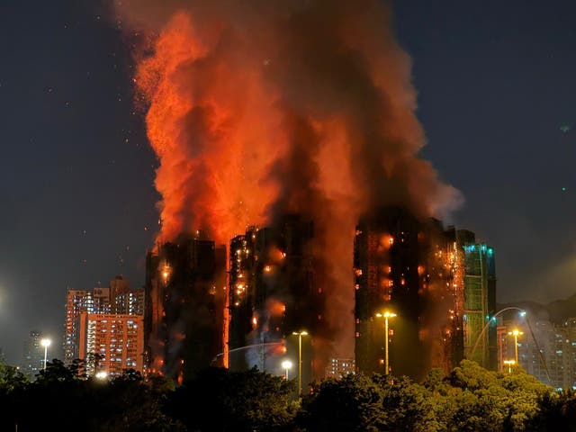 <p>Thick smoke and flames rise as a major fire engulfs several apartment blocks at the Wang Fuk Court residential estate in Hong Kong</p>
