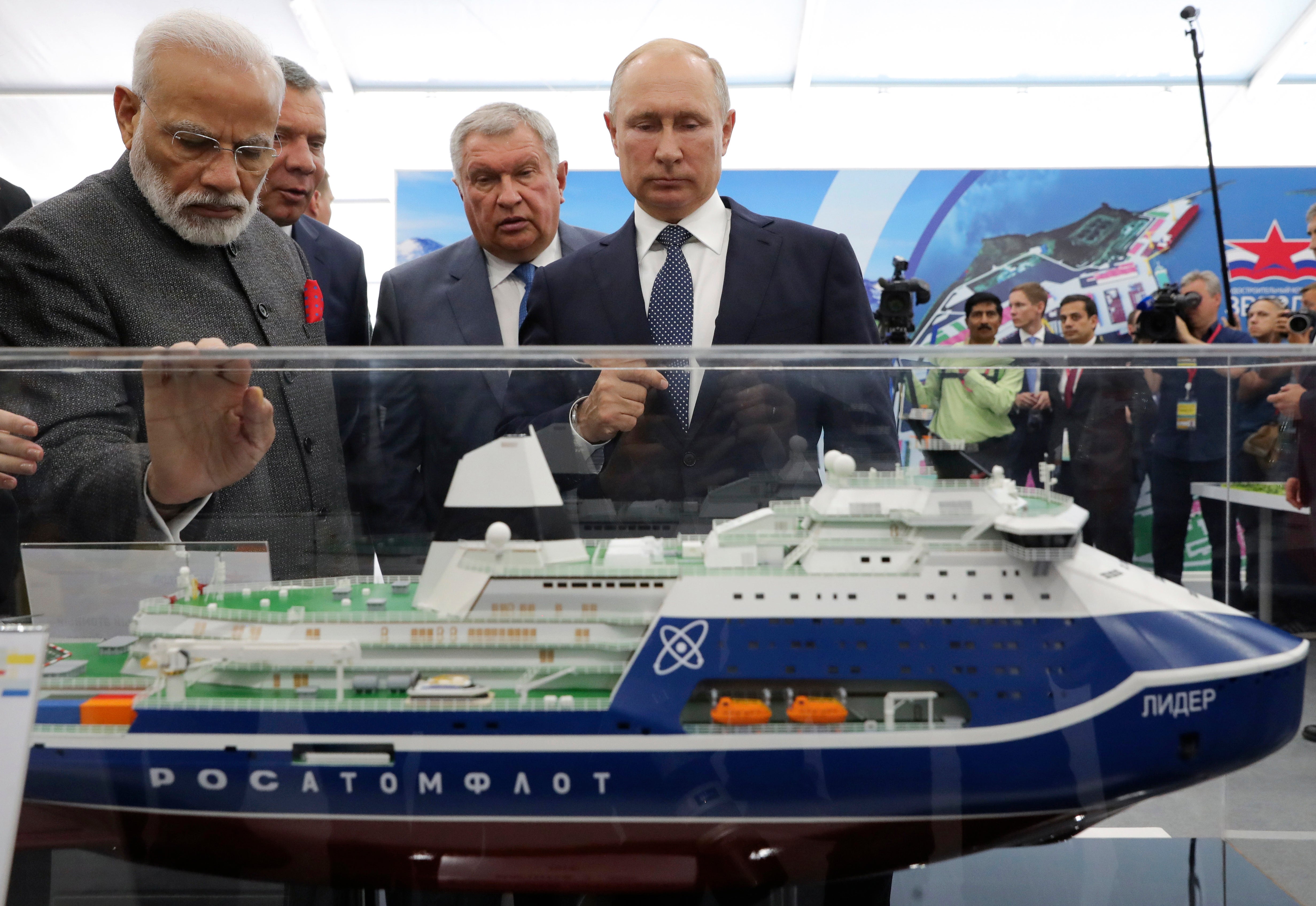 Russian President Vladimir Putin, right, and Indian Prime Minister Narendra Modi, left, look at a model of a Leader nuclear-powered icebreaker as they visit the Zvezda shipyard in the town of Bolshoi Kamen, Russia, on Sept. 4, 2019