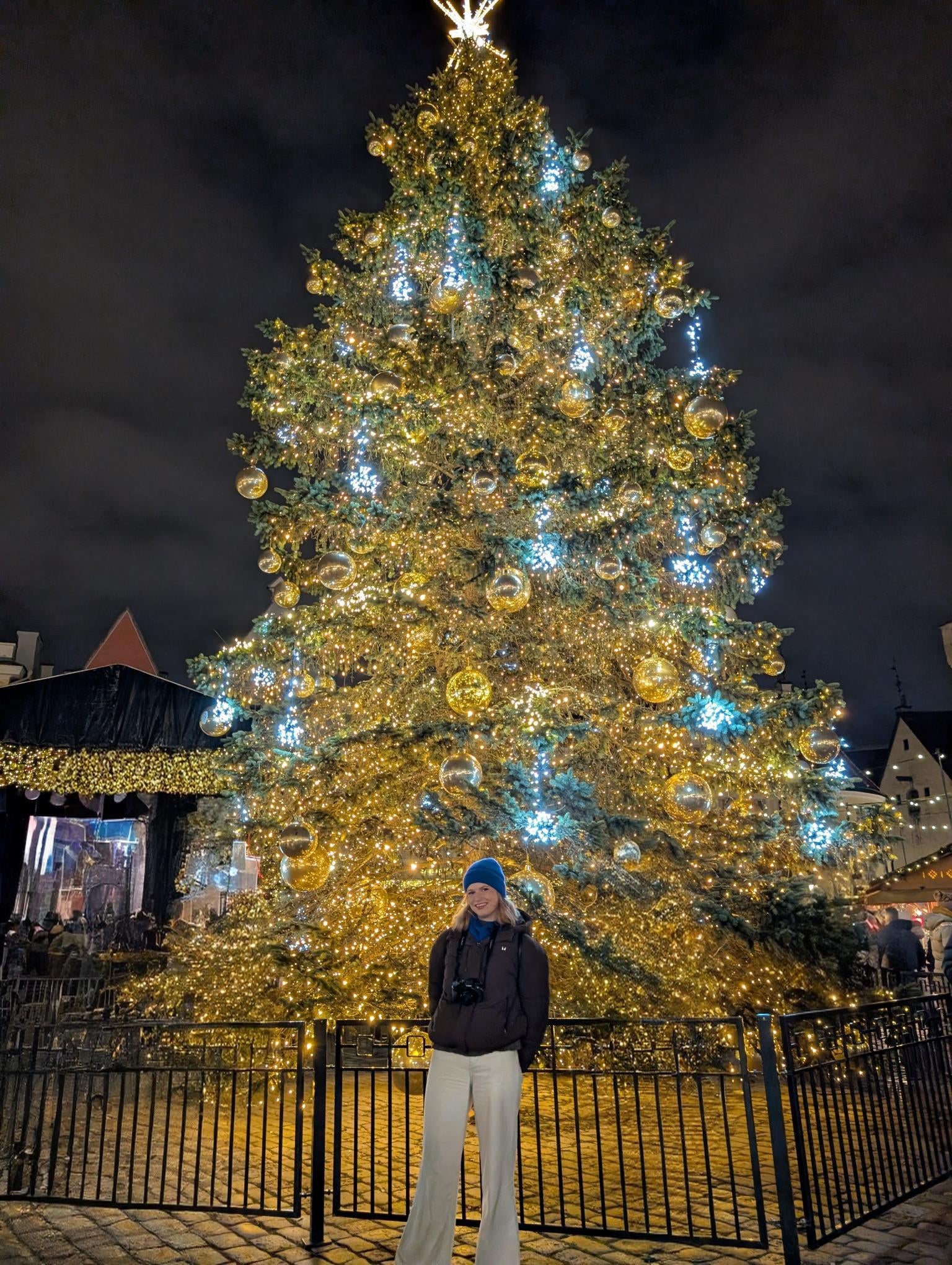 Rachael stands in front of the Christmas tree, which has stood in Tallinn’s Town Hall Square since 1441