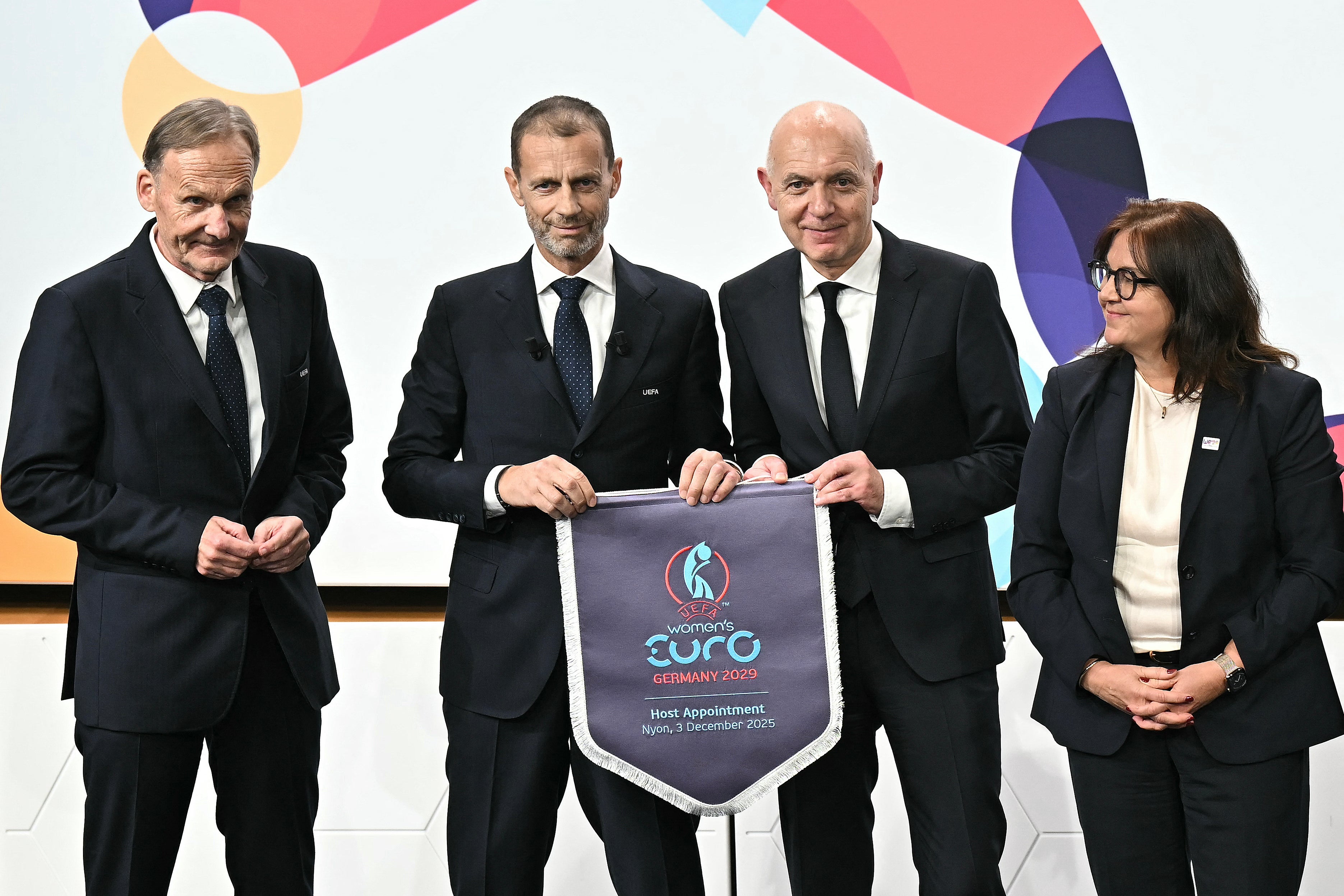 UEFA Vice-President Hans-Joachim Watzke, UEFA President Aleksander Ceferin, German Football Association (DFB) president Bernd Neuendorf and UEFA Managing Director of Communications Pedro Pinto (R) pose after Germany was elected to host the UEFA Women's EURO 2029 fooball tournament