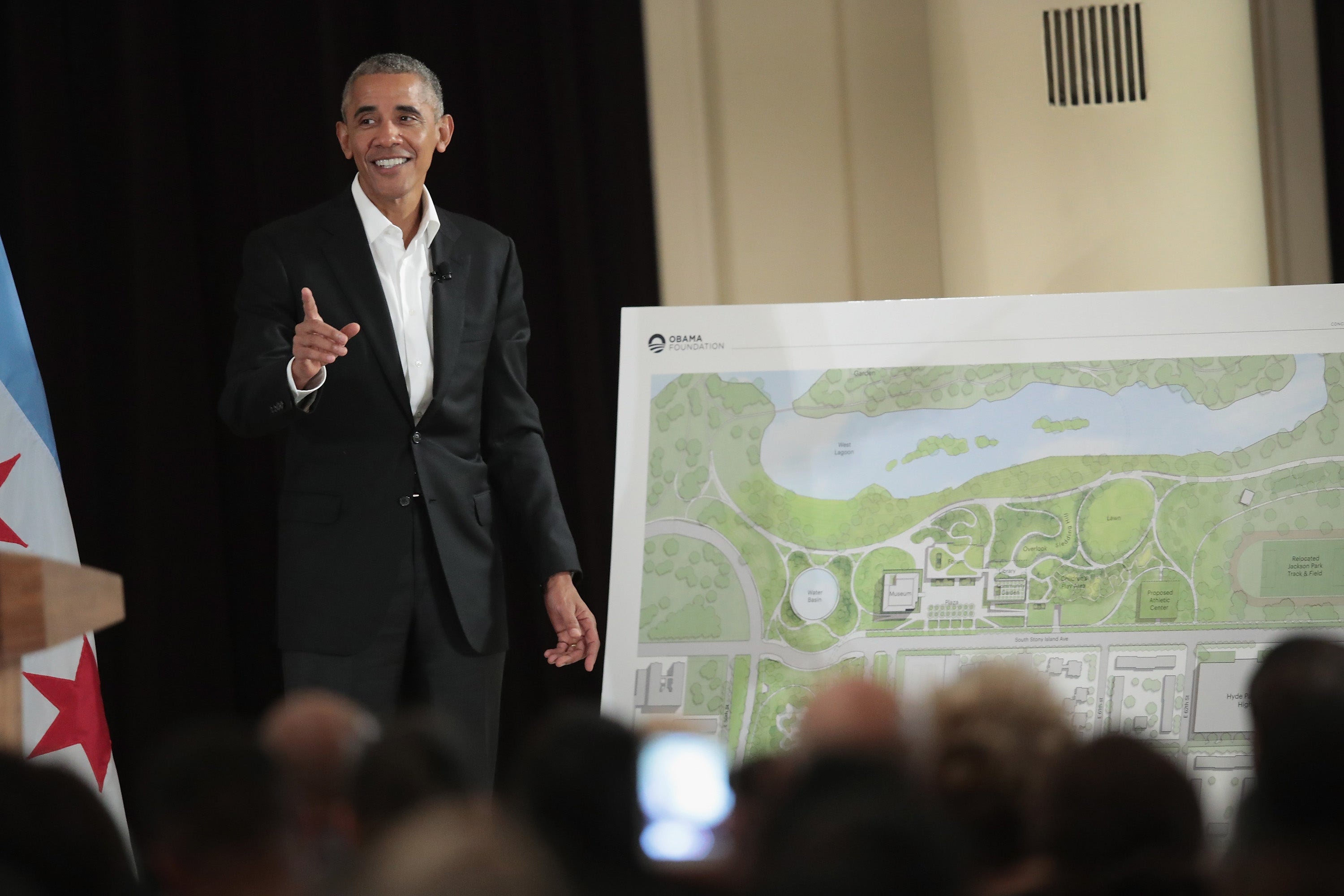 Former President Barack Obama displays a plan for the Obama Presidential Center in 2017 in Chicago