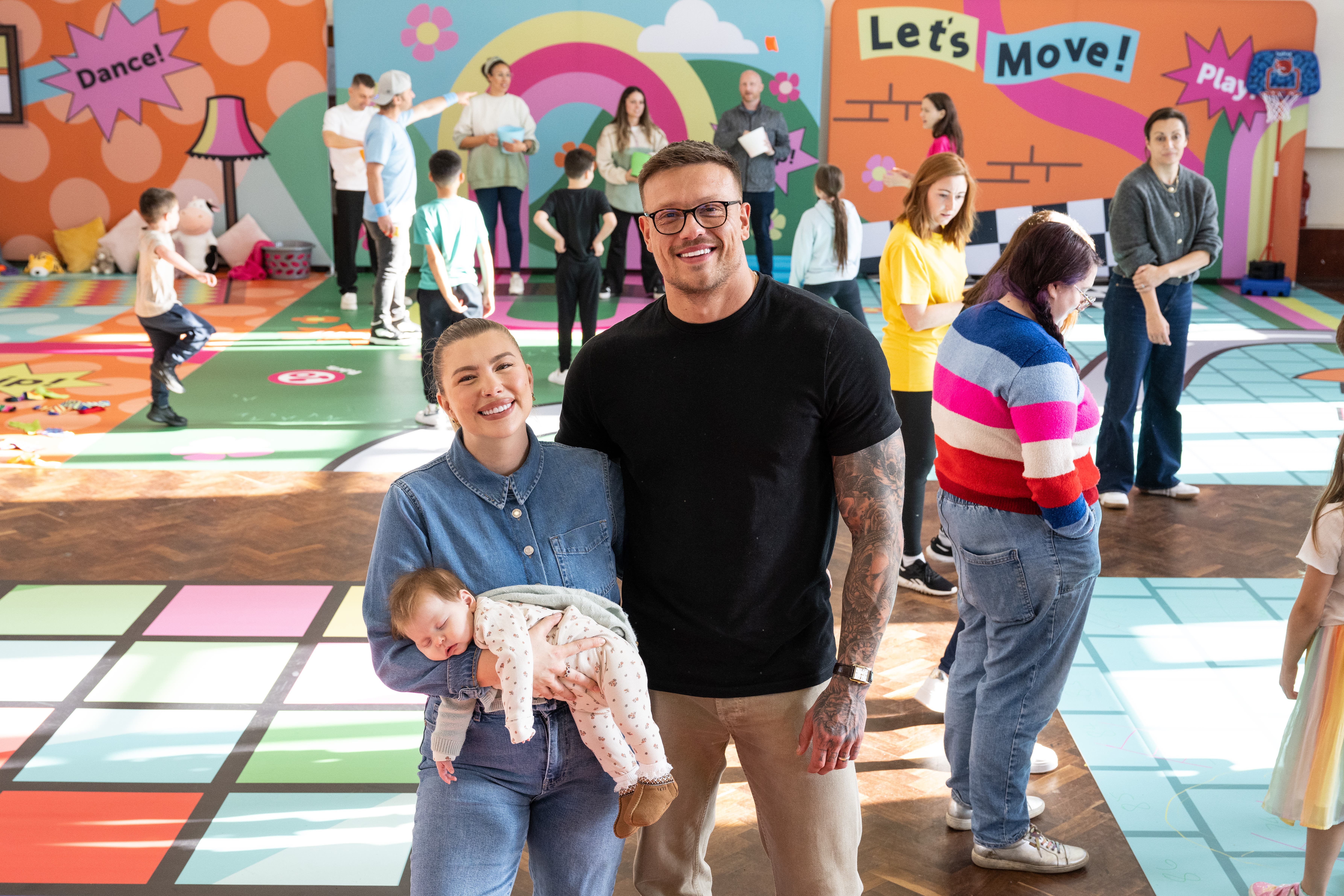 Getting kids moving:Olivia and Alex Bowen with their baby Siena (DCMS/PA)
