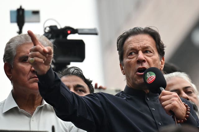 <p>Imran Khan addresses his supporters during an anti-government march towards capital Islamabad in 2022</p>