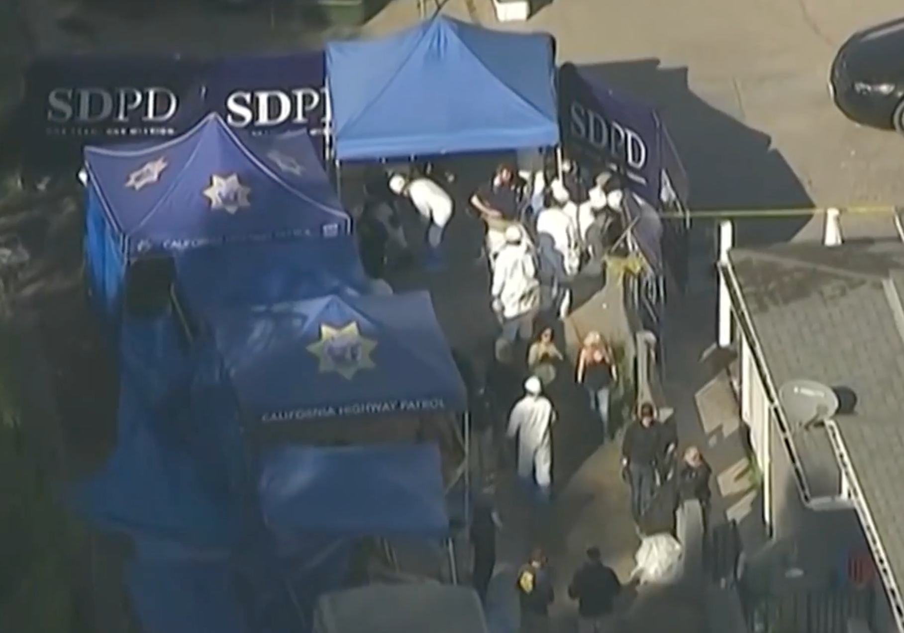 Investigators at the house in the Southcrest neighborhood of San Diego, where the human remains were unearthed