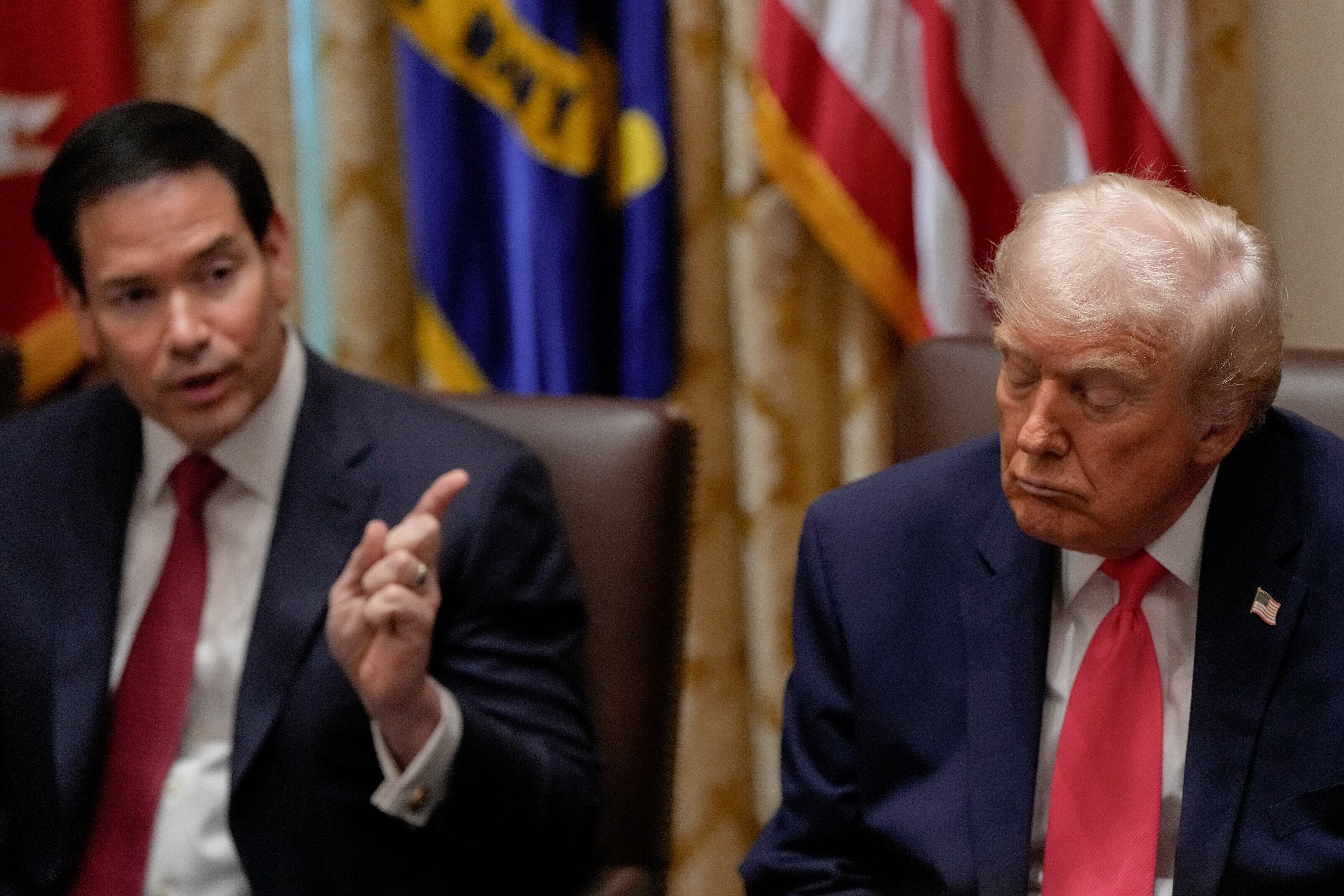 President Donald Trump closes his eyes as Secretary of State Marco Rubio speaks during a Cabinet meeting at the White House this week.