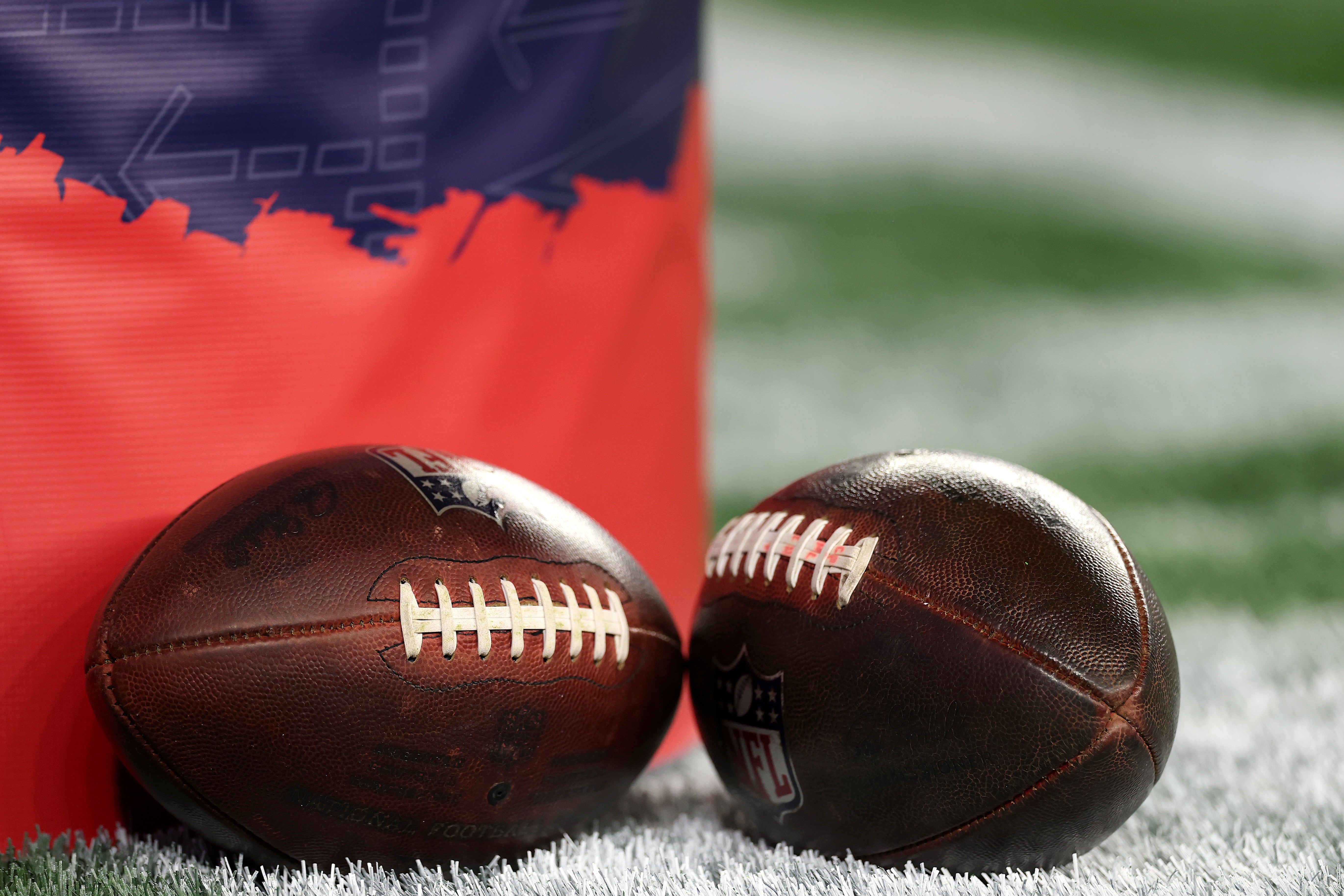<p>A general view of the NFL game ball on the field prior to the game between the New York Giants and the New England Patriots at Gillette Stadium on December 01, 2025 in Foxborough, Massachusetts</p>